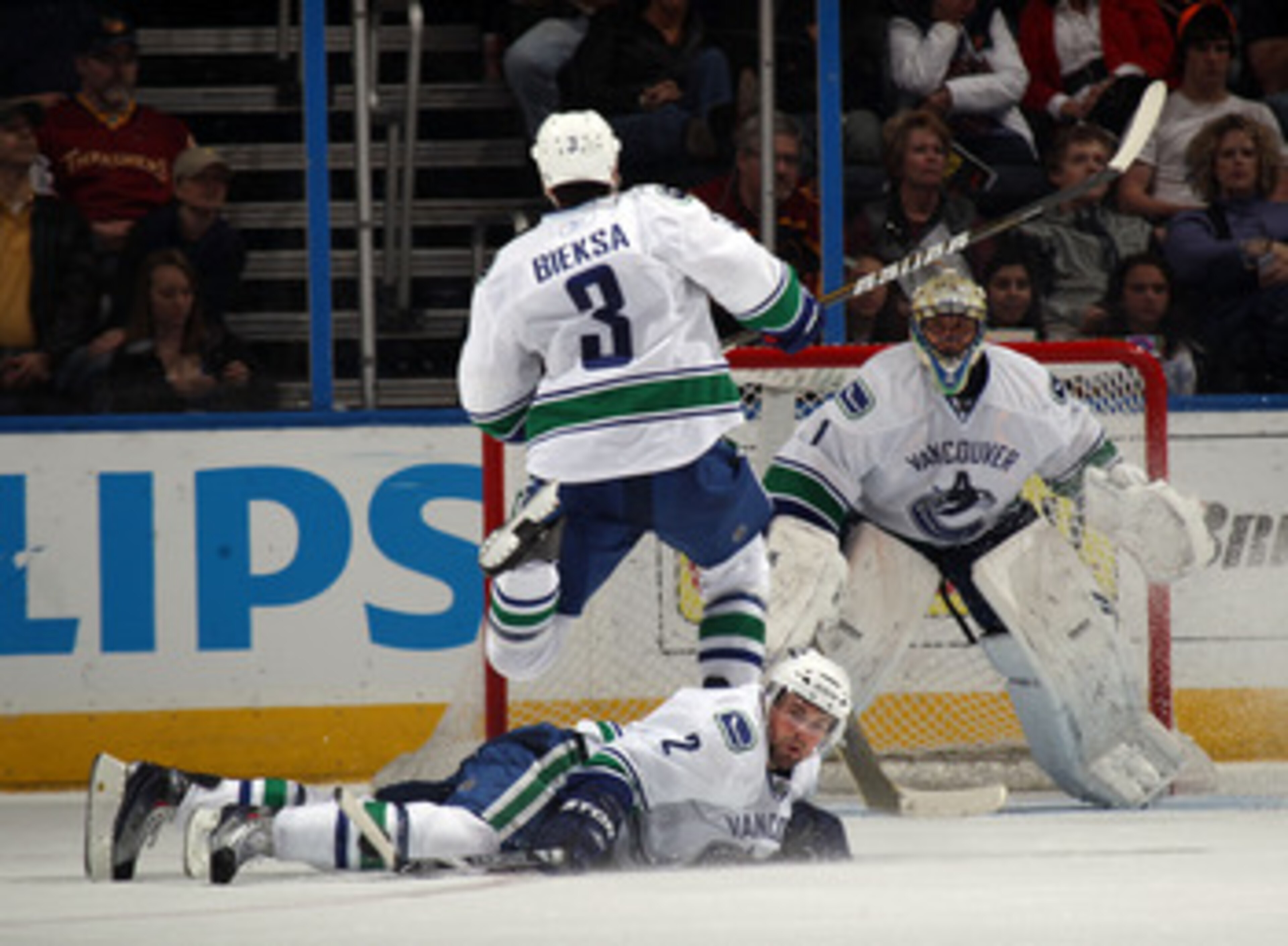ATLANTA, GA - MARCH 25: Kevin Bieksa #3 of the Vancouver Canucks jumps over Dan Hamhuis #2 to avoid contact during their game against the Atlanta Thrashers at the Philips Arena on March 25, 2011 in Atlanta, Georgia.  (Photo by Bruce Bennett/Getty Images)