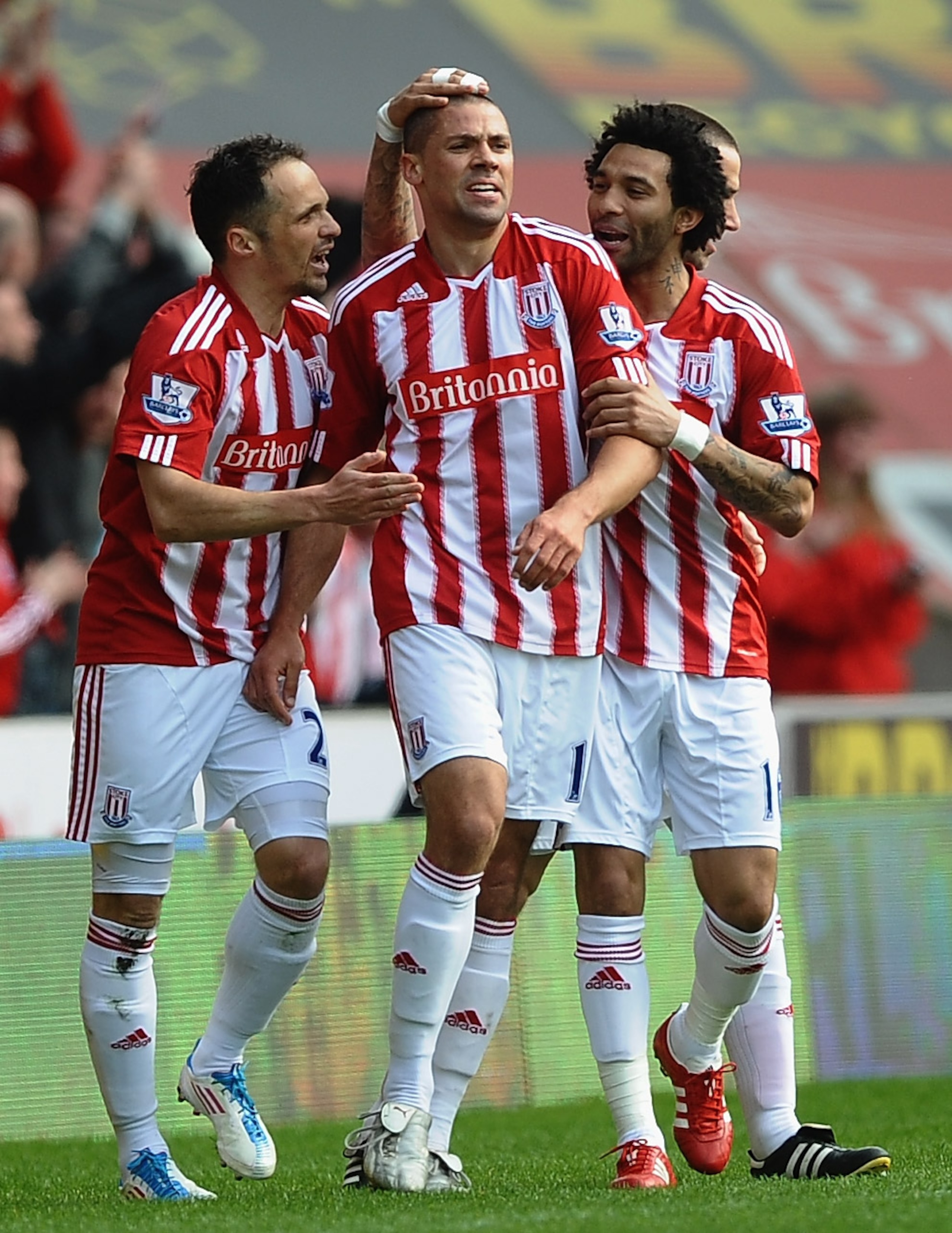 STOKE ON TRENT, ENGLAND - APRIL 02: Jonathan Walter of Stoke City is congratulated on his first half goal by Jermaine Pennant and Matthew Etherington during the Barclays Premier League match between Stoke City and Chelsea at Britannia Stadium on April 2,