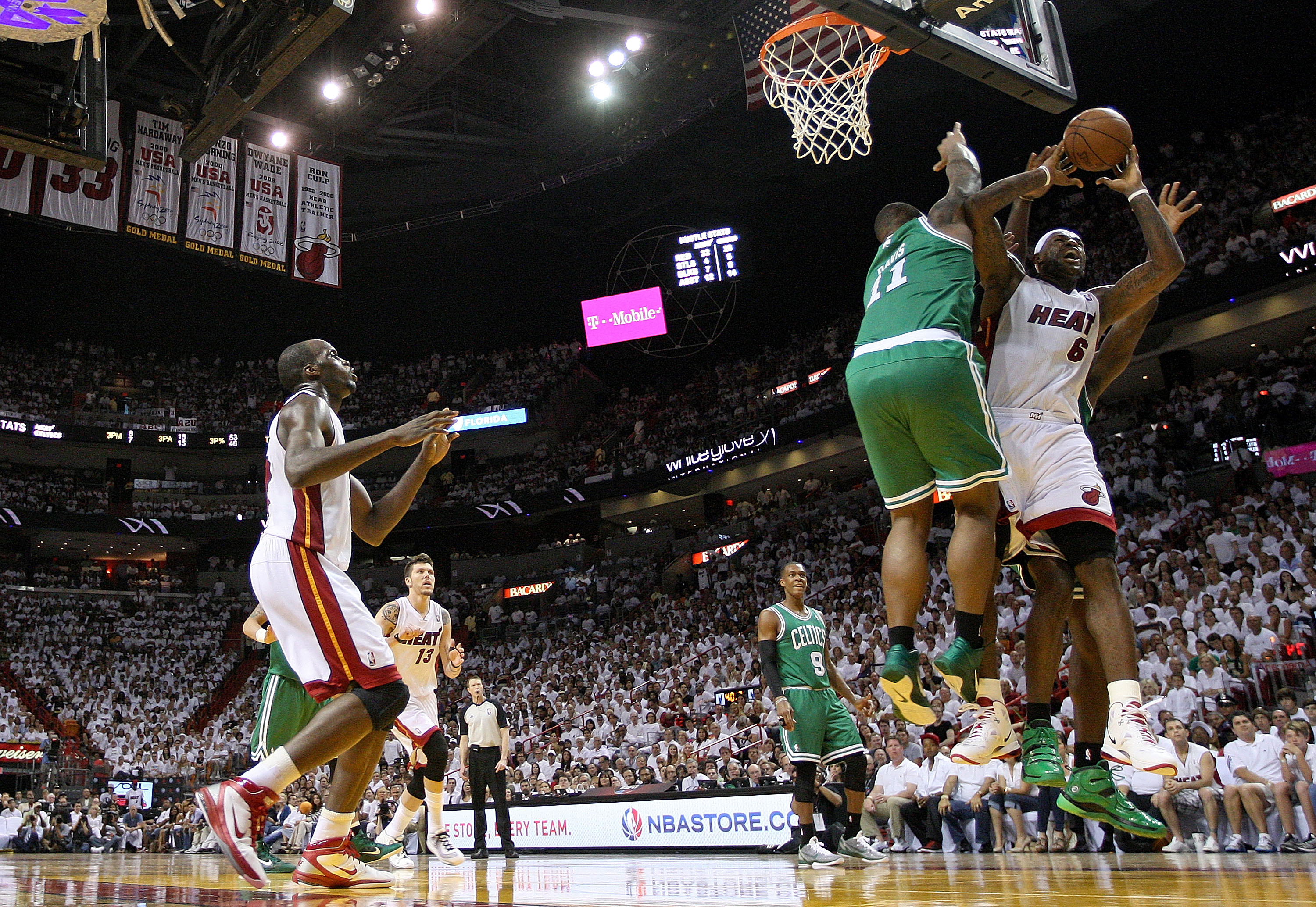 MIAMI, FL - MAY 01:  LeBron James #6 of the Miami Heat is fouled by Glen Davis #11 of the Boston Celtics during Game One of the Eastern Conference Semifinals of the 2011 NBA Playoffs at American Airlines Arena on May 1, 2011 in Miami, Florida. NOTE TO USE