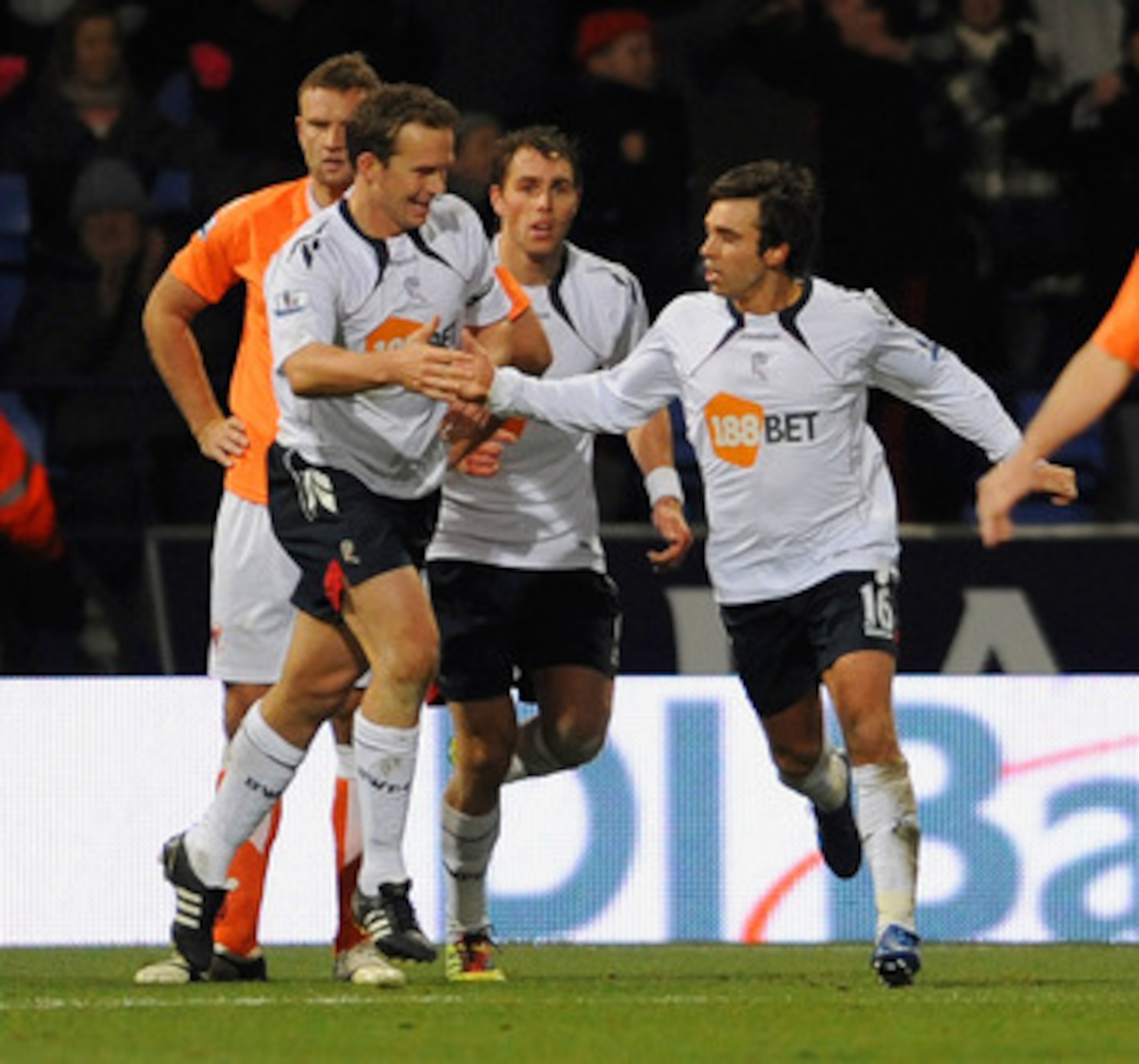 BOLTON, UNITED KINGDOM - NOVEMBER 27: Mark davies (R) of Bolton  celebrates after scoring the second goal for his side during the Barclays Premier League match between Bolton Wanderers and Blackpool at the Reebok Stadium on November 27, 2010 in Bolton, En