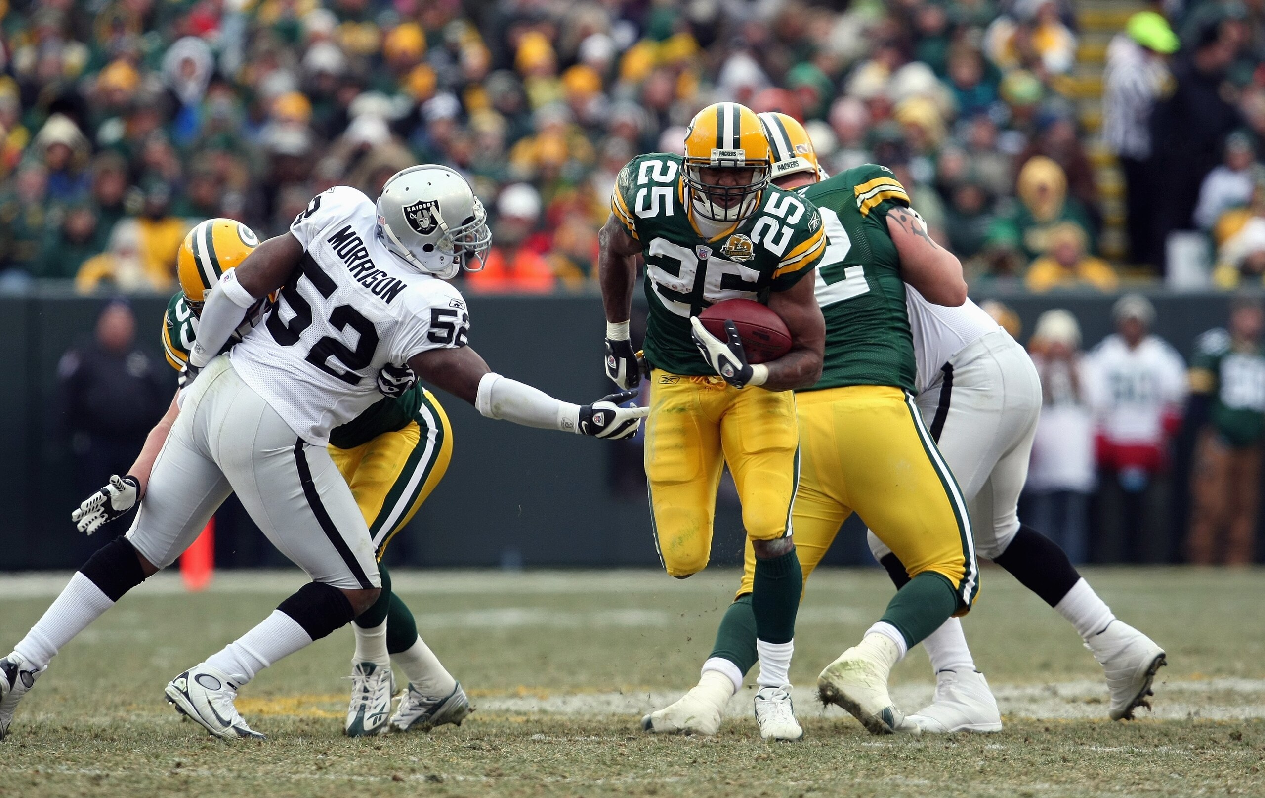 GREEN BAY, WI - DECEMBER 09: Ryan Grant #25 of the Green Bay Packers carries the ball against the Oakland Raiders on December 9, 2007 at Lambeau Field in Green Bay, Wisconsin. The Packers defeated the Raiders 38-7 to win the NFC North Division title. (Pho GREEN BAY, WI - DECEMBER 09: Ryan Grant #25 of the Green Bay Packers carries the ball against the Oakland Raiders on December 9, 2007 at Lambeau Field in Green Bay, Wisconsin. The Packers defeated the Raiders 38-7 to win the NFC North Division title. (Pho