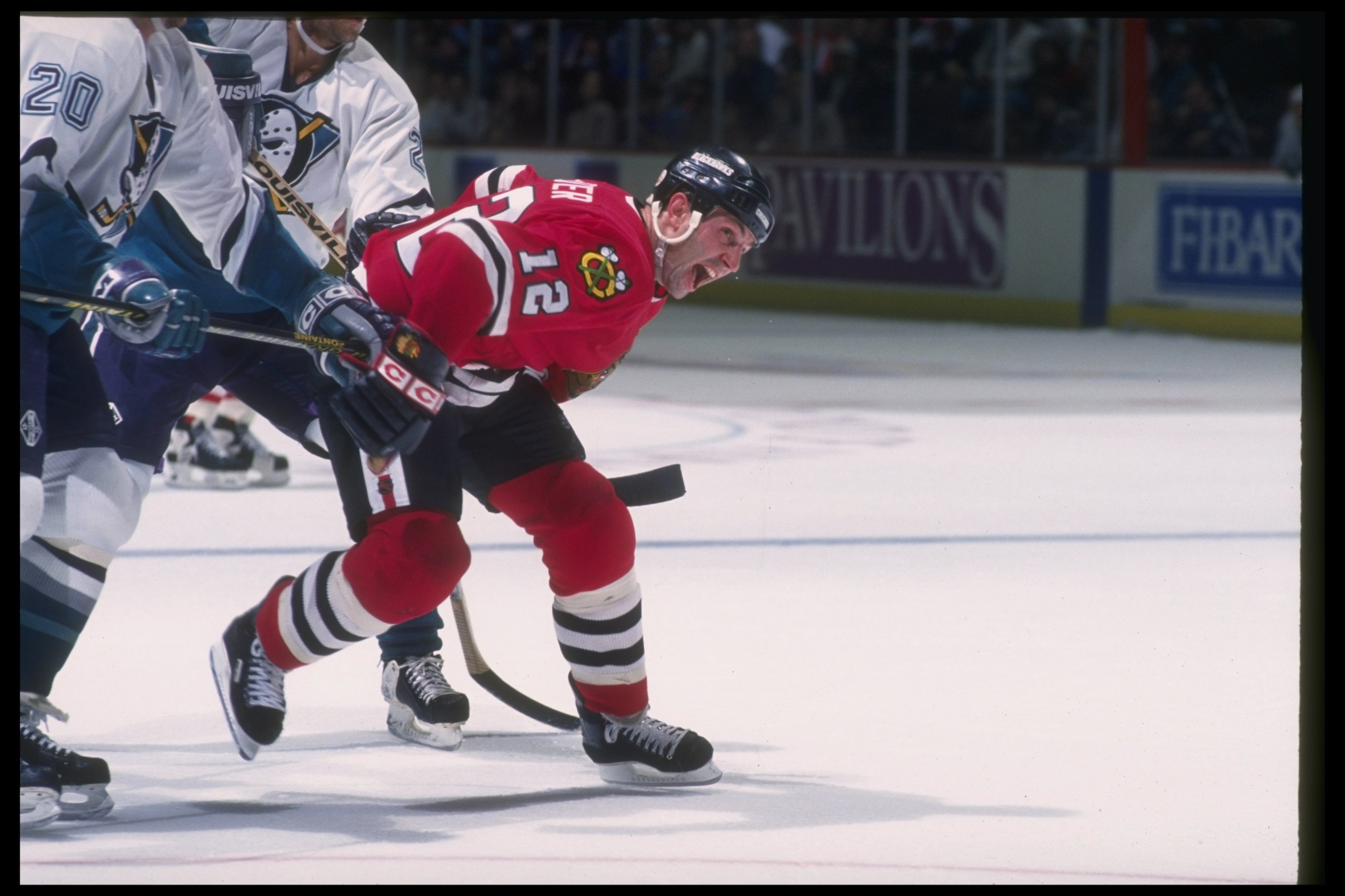 11 Mar 1994:  Center Brent Sutter of the Chicago Blackhawks works against the Anaheim Mighty Ducks during a game at Arrowhead Pond in Anaheim, California. Mandatory Credit: J.D. Cuban  /Allsport