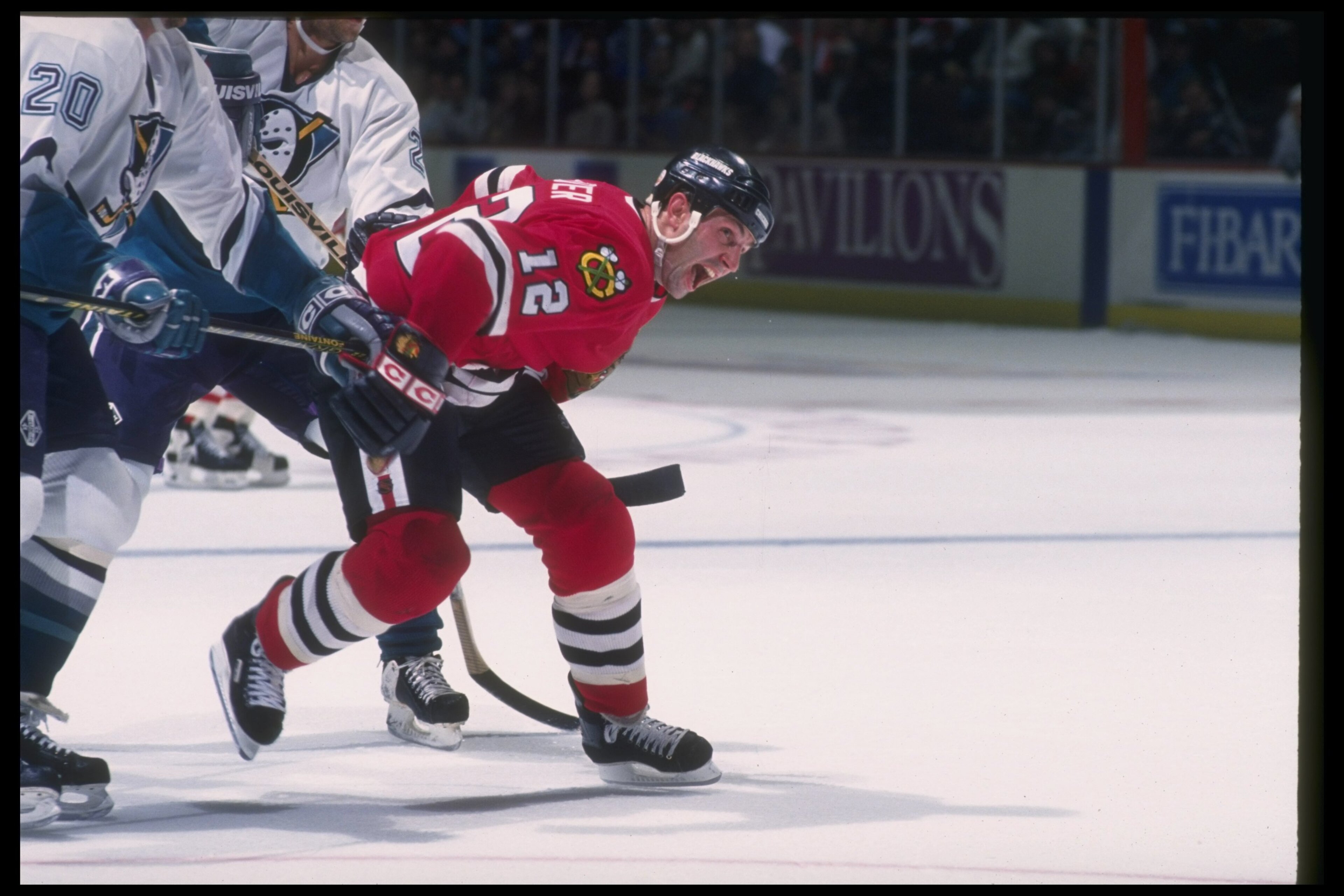 11 Mar 1994:  Center Brent Sutter of the Chicago Blackhawks works against the Anaheim Mighty Ducks during a game at Arrowhead Pond in Anaheim, California. Mandatory Credit: J.D. Cuban  /Allsport