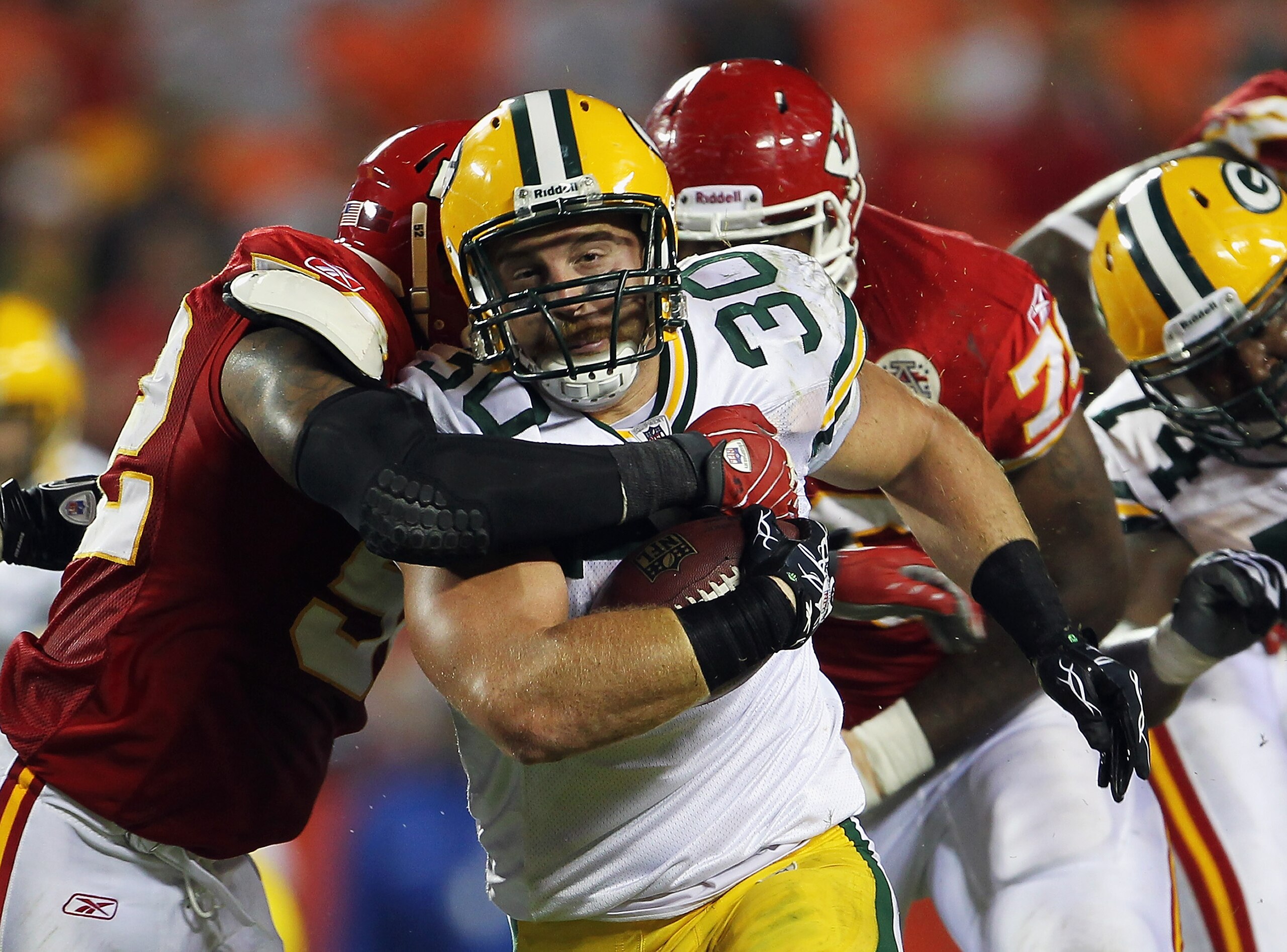 KANSAS CITY, MO - SEPTEMBER 02: Fullback John Kuhn #30 of the Green Bay Packers carries the ball during the game against the Kansas City Chiefs on September 2, 2010 at Arrowhead Stadium in Kansas City, Missouri. (Photo by Jamie Squire/Getty Images) KANSAS CITY, MO - SEPTEMBER 02: Fullback John Kuhn #30 of the Green Bay Packers carries the ball during the game against the Kansas City Chiefs on September 2, 2010 at Arrowhead Stadium in Kansas City, Missouri. (Photo by Jamie Squire/Getty Images)
