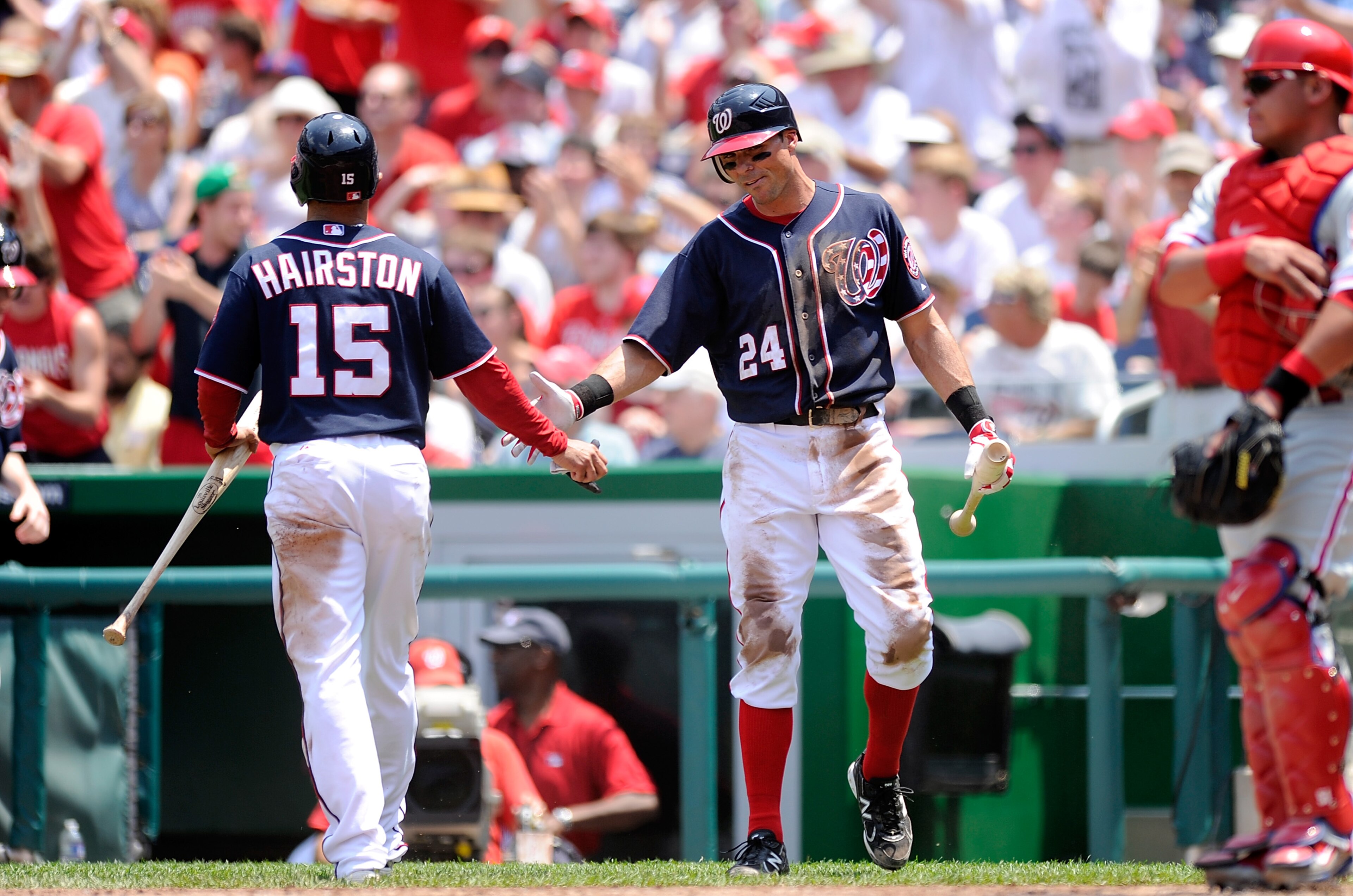 WASHINGTON, DC - MAY 30:  Jerry Hairston Jr. #15 is congratulated by Rick Ankiel #24 of the Washington Nationals after scoring in the second inning against the Philadelphia Phillies at Nationals Park on May 30, 2011 in Washington, DC.  (Photo by Greg Fium