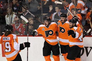 PHILADELPHIA - JUNE 09:  Danny Briere #48 of the Philadelphia Flyers celebrates with teammate Lukas Krajicek #2, Kimmo Timonen #44 and Scott Hartnell #19 after scoring a goal in the second period against the Chicago Blackhawks in Game Six of the 2010 NHL