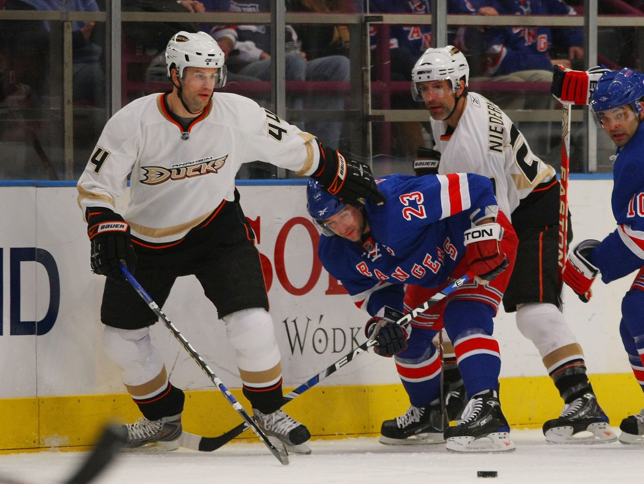 NEW YORK - JANUARY 20: Brothers Rob Niedermayer #44 (L) and Scott Niedermayer #27 (R) of the Anaheim Ducks combine to check Chris Drury #23 of the New York Rangers on January 20, 2009 at Madison Square Garden in New York City. The Rangers defeated the Duc