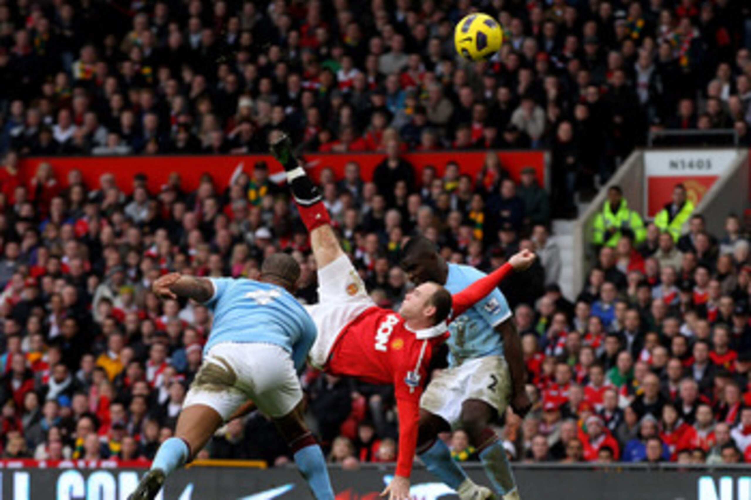 MANCHESTER, ENGLAND - FEBRUARY 12:  Wayne Rooney of Manchester United scores a goal from an overhead kick during the Barclays Premier League match between Manchester United and Manchester City at Old Trafford on February 12, 2011 in Manchester, England.