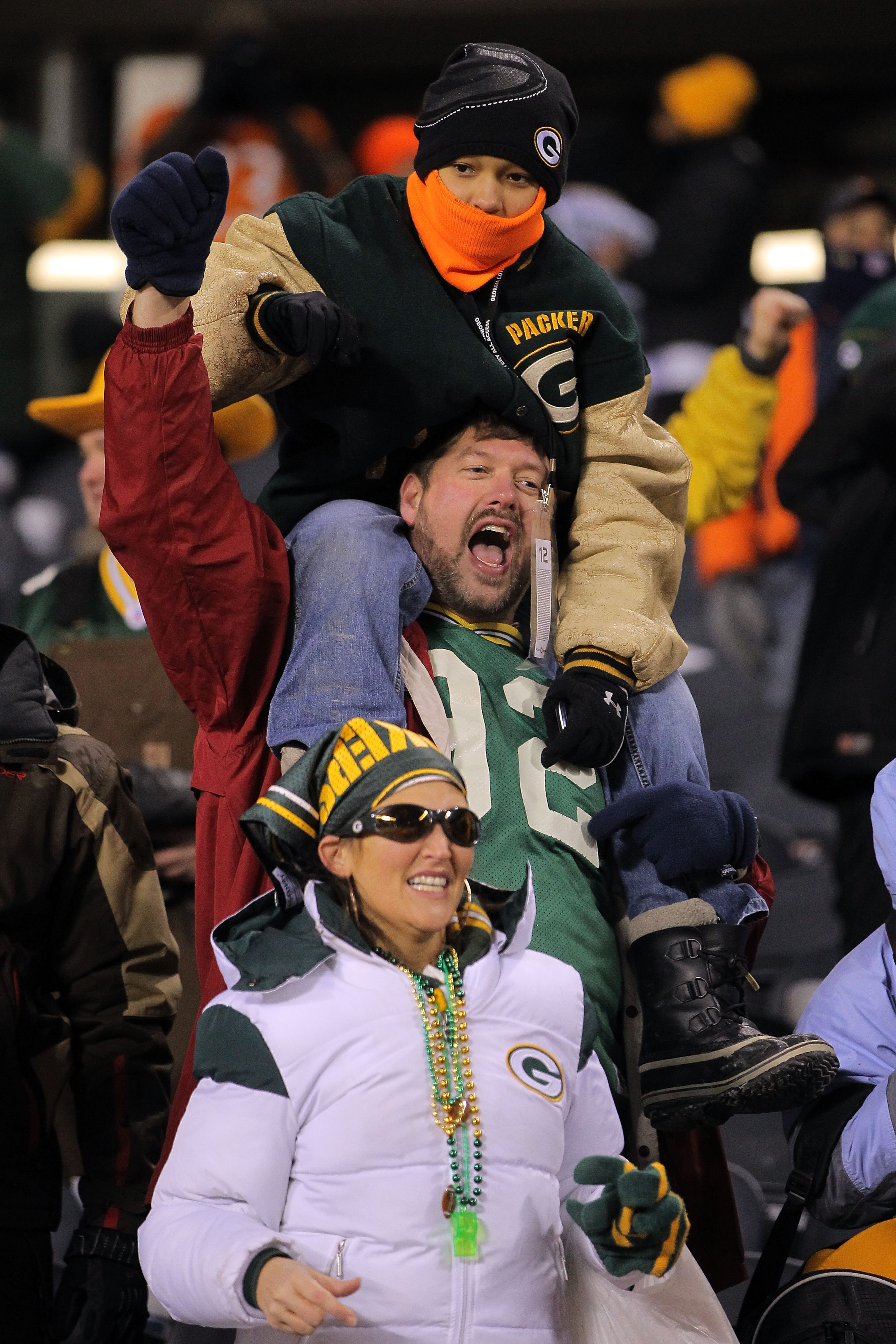 CHICAGO, IL - JANUARY 23:  Fans of the Green Bay Packers cheer as the Packers take on the Chicago Bears in the NFC Championship Game at Soldier Field on January 23, 2011 in Chicago, Illinois.  (Photo by Doug Pensinger/Getty Images)