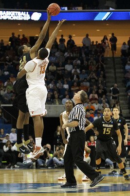 TULSA, OK - MARCH 18:  Keith Benson #34 of the Oakland Golden Grizzlies and Tristan Thompson #13 of the Texas Longhorns jump for the ball during the tip off of their game in the second round of the 2011 NCAA men's basketball tournament at BOK Center on Ma
