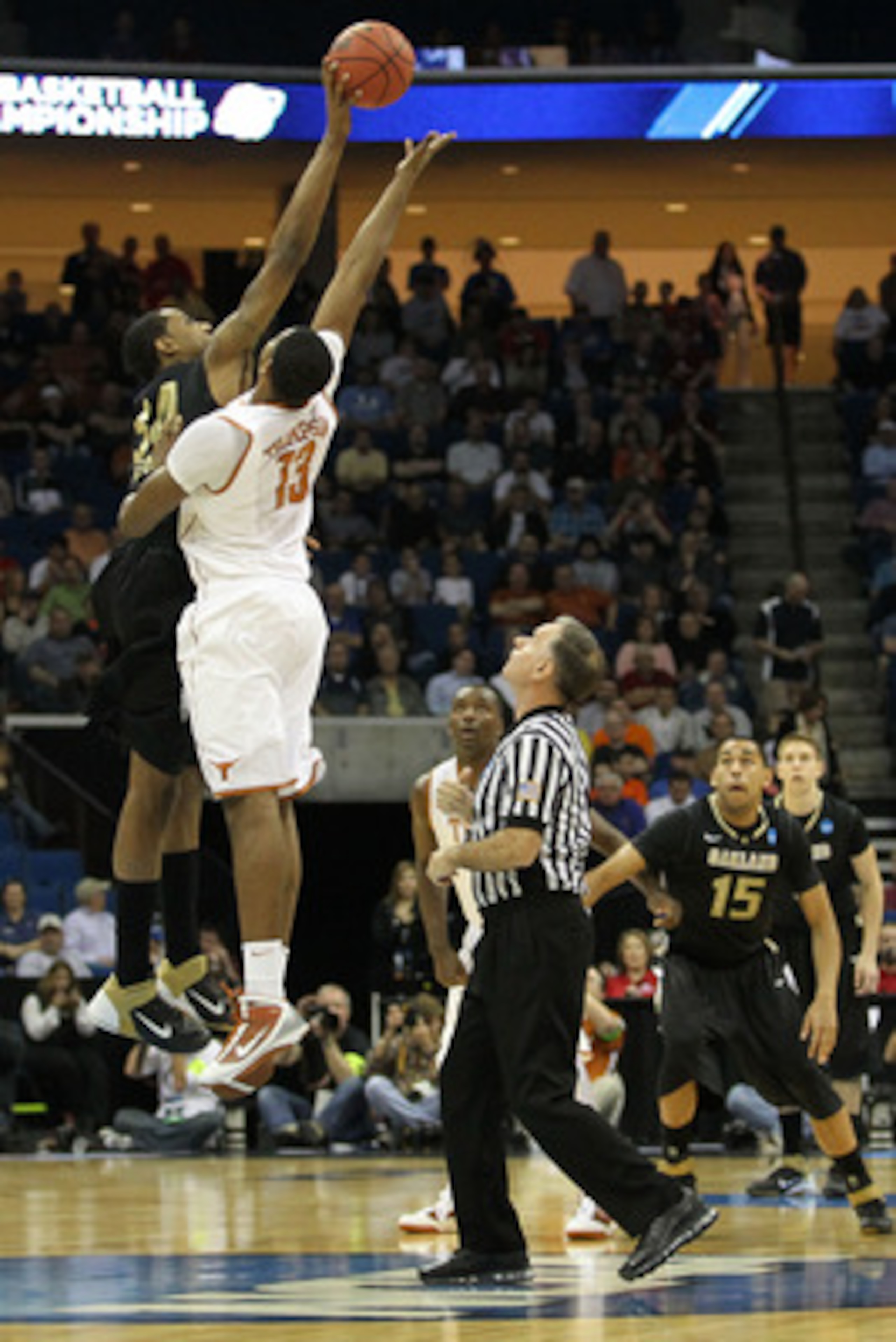 TULSA, OK - MARCH 18:  Keith Benson #34 of the Oakland Golden Grizzlies and Tristan Thompson #13 of the Texas Longhorns jump for the ball during the tip off of their game in the second round of the 2011 NCAA men's basketball tournament at BOK Center on Ma