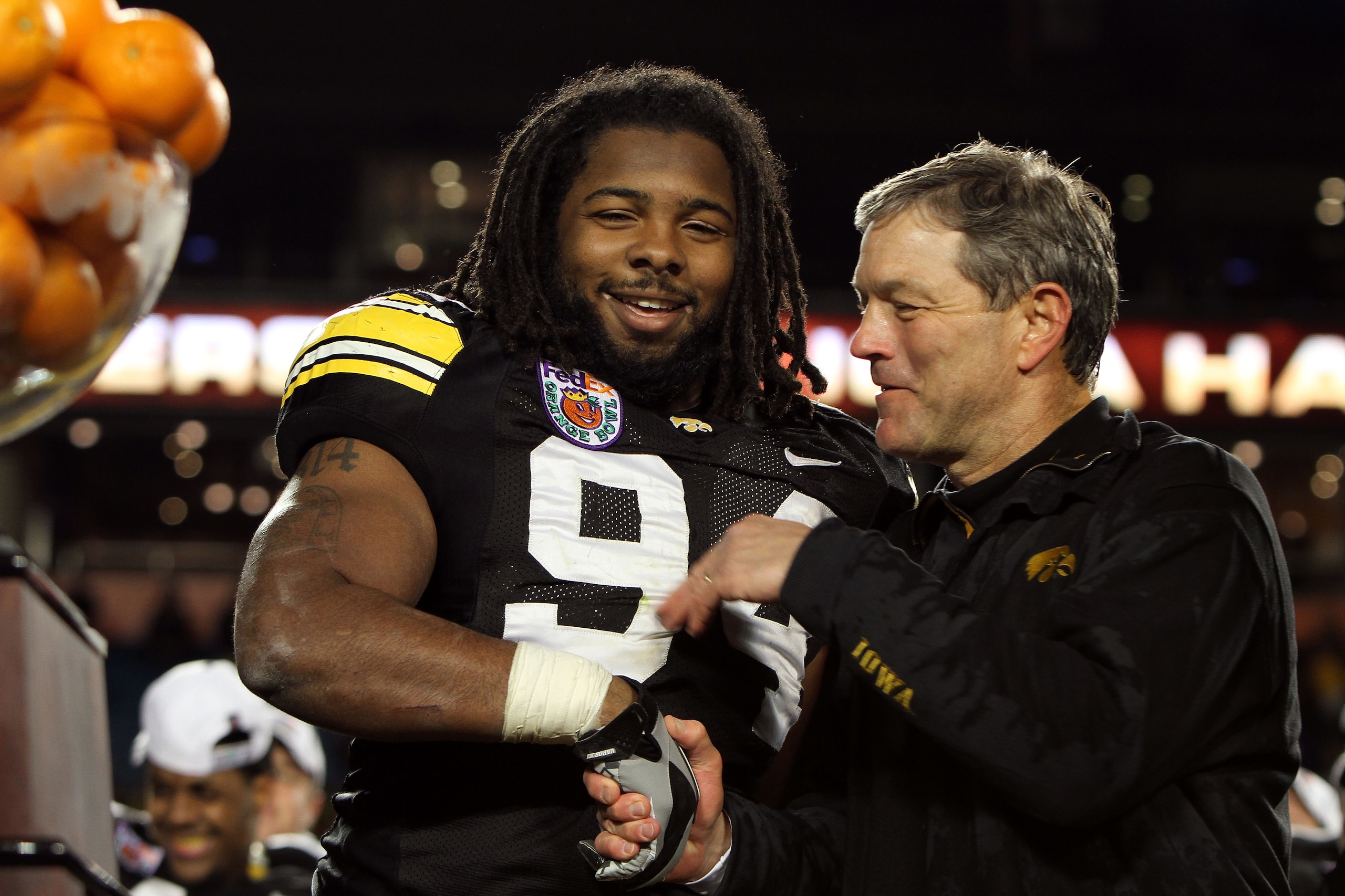 MIAMI GARDENS, FL - JANUARY 05: (L-R) Adrian Clayborn #94 and head coach Kirk Ferentz of the Iowa Hawkeyes celebrate after their 24-14 win against the Georgia Tech Yellow Jackets during the FedEx Orange Bowl at Land Shark Stadium on January 5, 2010 in Mi MIAMI GARDENS, FL - JANUARY 05: (L-R) Adrian Clayborn #94 and head coach Kirk Ferentz of the Iowa Hawkeyes celebrate after their 24-14 win against the Georgia Tech Yellow Jackets during the FedEx Orange Bowl at Land Shark Stadium on January 5, 2010 in Mi