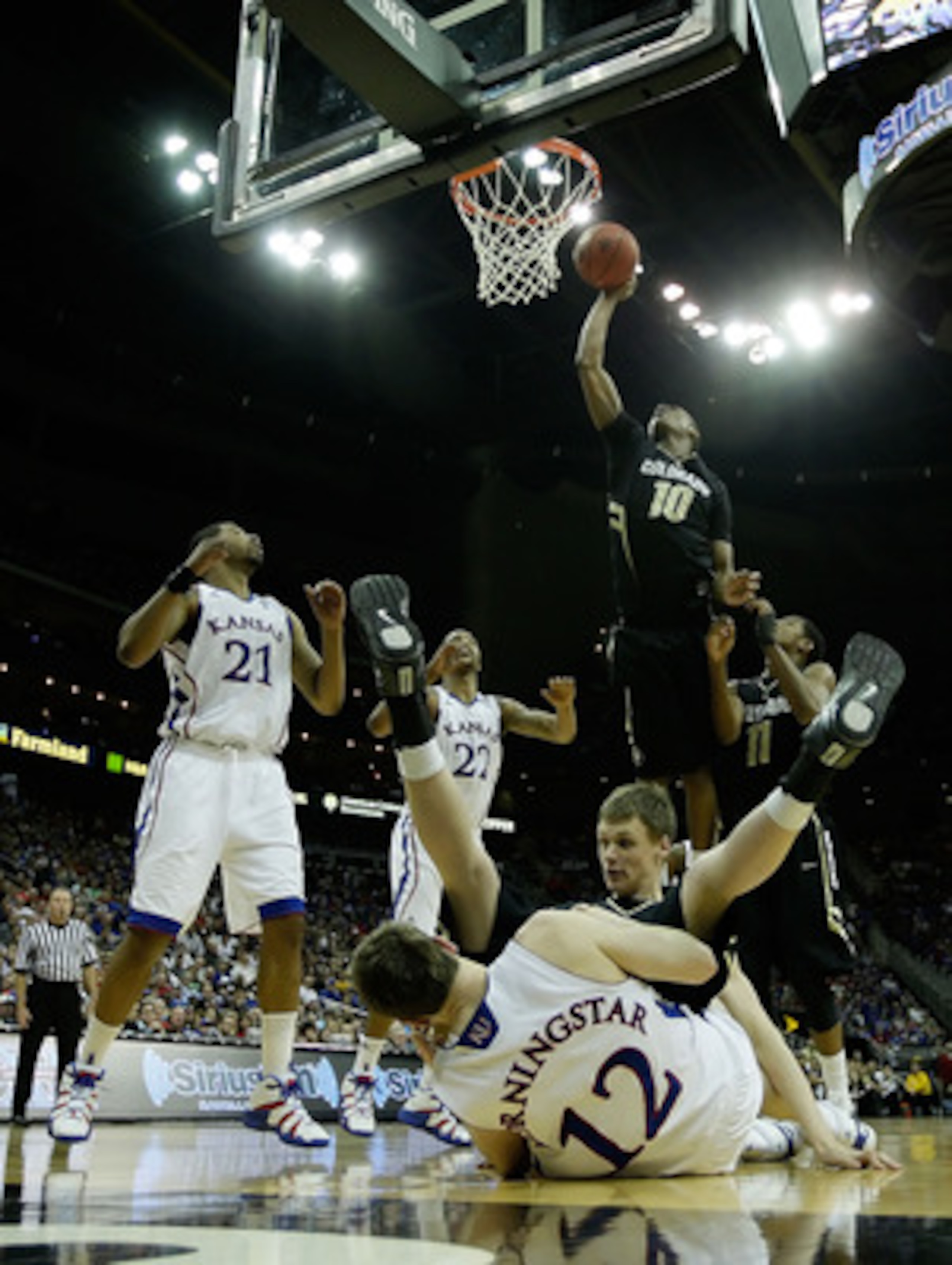 KANSAS CITY, MO - MARCH 11:  Alec Burks #10 of the Colorado Buffaloes goes up for a shot against the Kansas Jayhawks during their semifinal game in the 2011 Phillips 66 Big 12 Men's Basketball Tournament at Sprint Center on March 11, 2011 in Kansas City, 