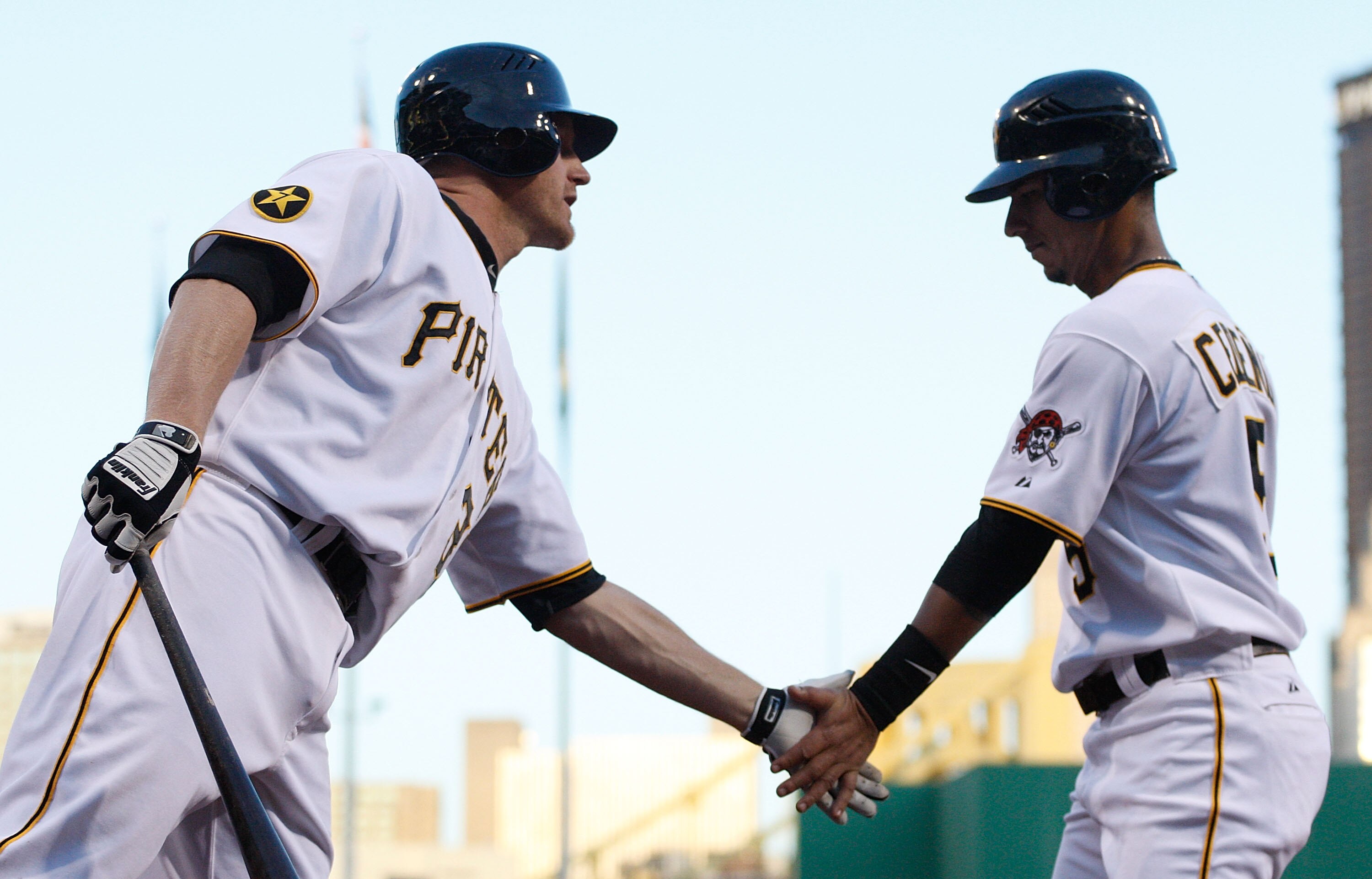 PITTSBURGH - MAY 09:  Ronny Cedeno #5 of the Pittsburgh Pirates is congratulated by teammate Lyle Overbay #37 after scoring against the Los Angeles Dodgers during the game on May 9, 2011 at PNC Park in Pittsburgh, Pennsylvania.  (Photo by Jared Wickerham/