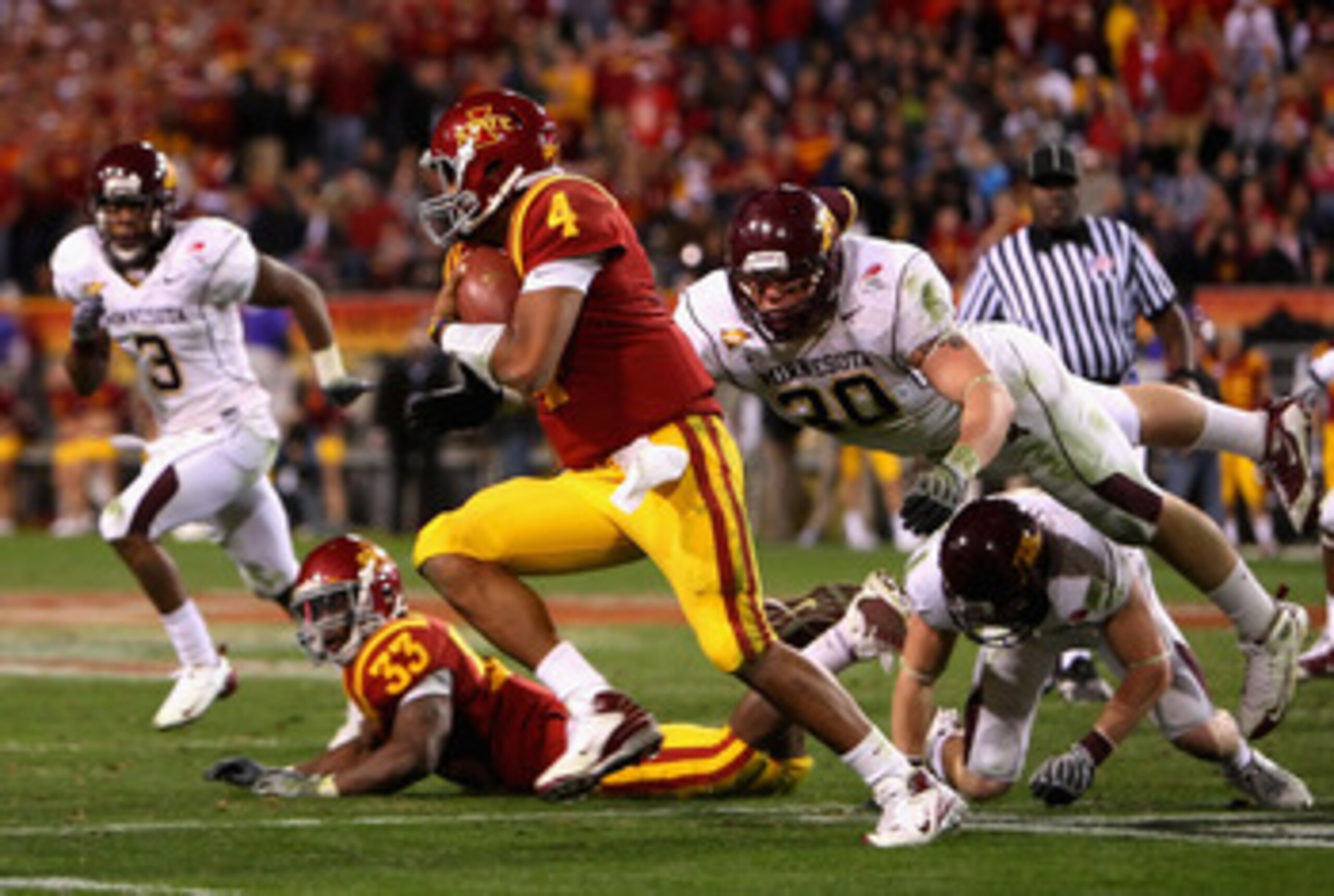 TEMPE, AZ - DECEMBER 31: Quarterback Austen Arnaud #4 of the Iowa State Cyclones scrambles with the ball past Lee Campbell #30 of the Minnesota Golden Gophers during the Insight Bowl at Arizona Stadium on December 31, 2009 in Tempe, Arizona. The Cyclones TEMPE, AZ - DECEMBER 31: Quarterback Austen Arnaud #4 of the Iowa State Cyclones scrambles with the ball past Lee Campbell #30 of the Minnesota Golden Gophers during the Insight Bowl at Arizona Stadium on December 31, 2009 in Tempe, Arizona. The Cyclones