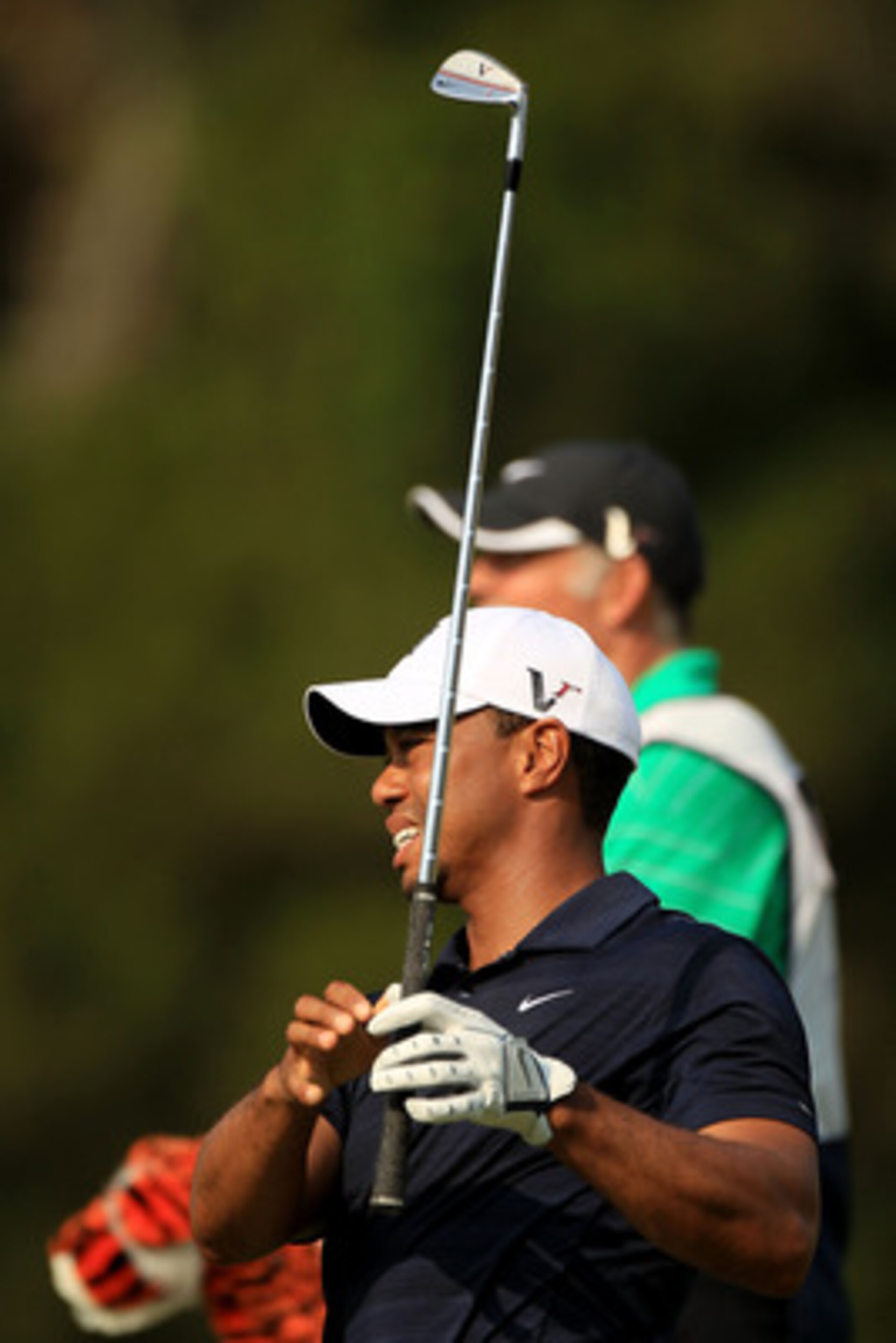 PONTE VEDRA BEACH, FL - MAY 12:  Tiger Woods hits a shot on the fifth hole as caddie Steve Williams looks on during the first round of THE PLAYERS Championship held at THE PLAYERS Stadium course at TPC Sawgrass on May 12, 2011 in Ponte Vedra Beach, Florid