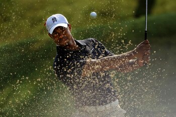 PONTE VEDRA BEACH, FL - MAY 12:  Tiger Woods hits from a bunker on the sixth hole during the first round of THE PLAYERS Championship held at THE PLAYERS Stadium course at TPC Sawgrass on May 12, 2011 in Ponte Vedra Beach, Florida. Woods withdrew after sho