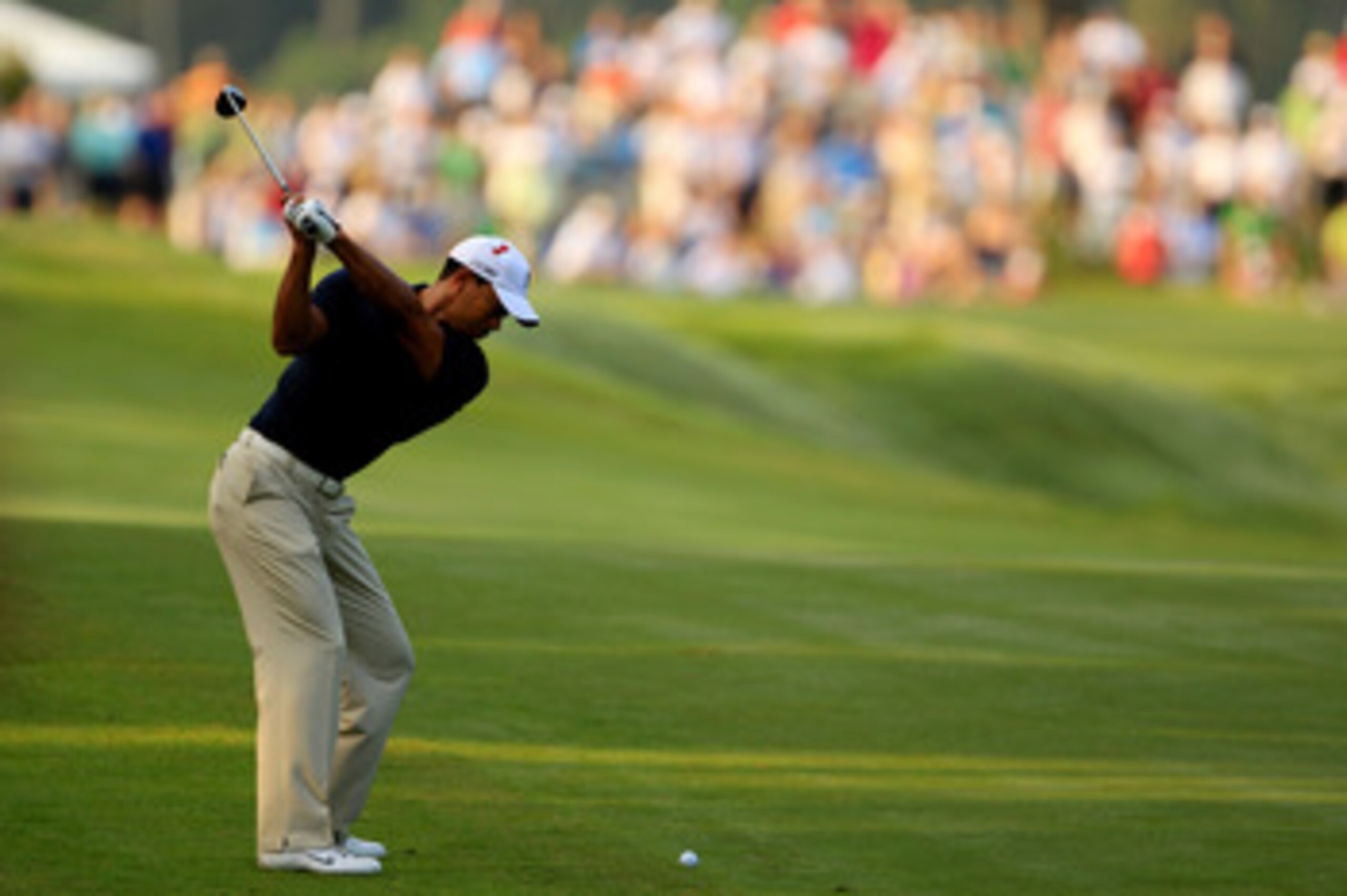 PONTE VEDRA BEACH, FL - MAY 12:  Tiger Woods hits an approach shot on the second hole during the first round of THE PLAYERS Championship held at THE PLAYERS Stadium course at TPC Sawgrass on May 12, 2011 in Ponte Vedra Beach, Florida.  (Photo by Streeter 