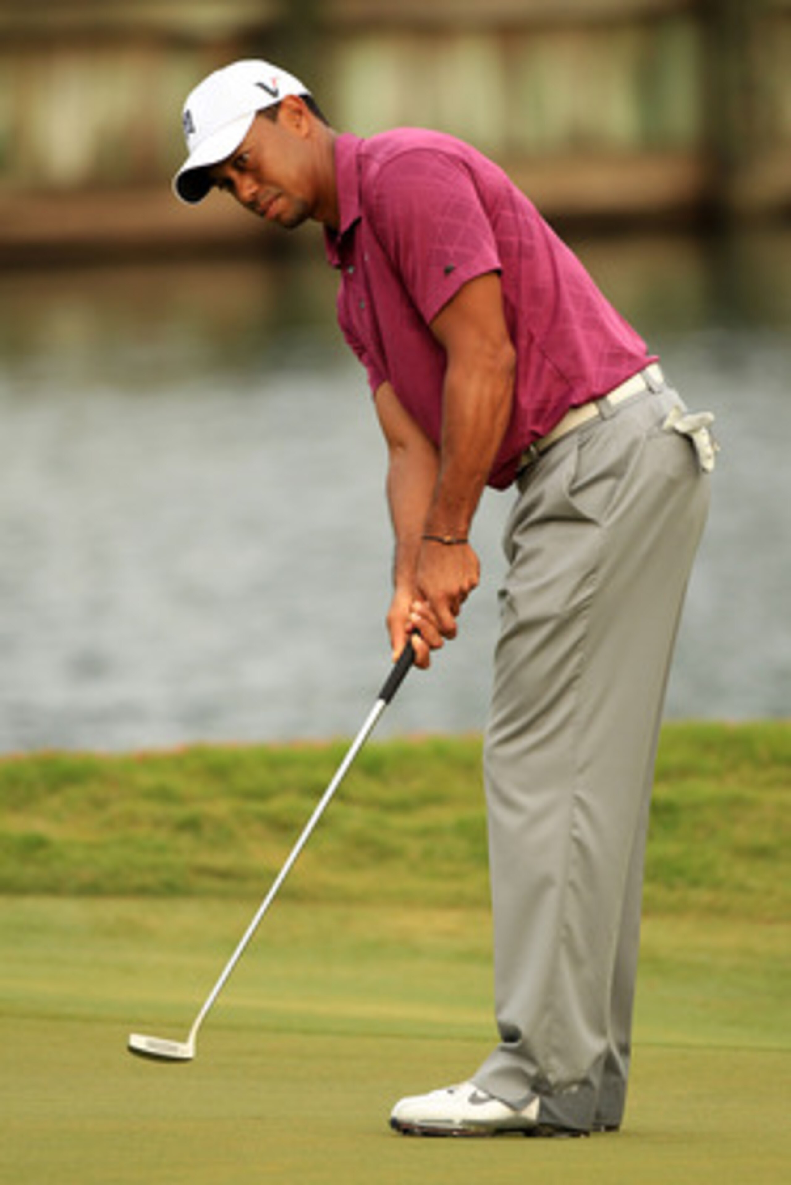 PONTE VEDRA BEACH, FL - MAY 11:  Tiger Woods putts during a practice round prior to the start of THE PLAYERS Championship held at THE PLAYERS Stadium course at TPC Sawgrass on May 11, 2011 in Ponte Vedra Beach, Florida.  (Photo by Streeter Lecka/Getty Ima