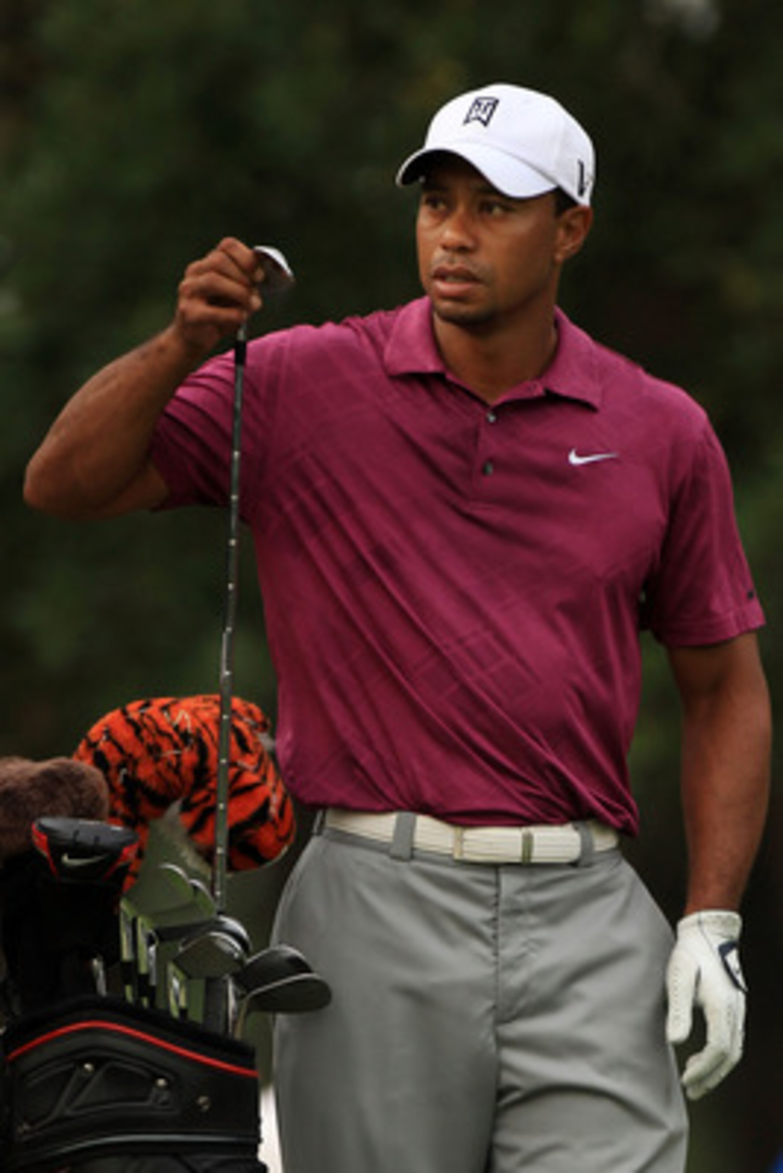 PONTE VEDRA BEACH, FL - MAY 11:  Tiger Woods pulls a club from his bag during a practice round prior to the start of THE PLAYERS Championship held at THE PLAYERS Stadium course at TPC Sawgrass on May 11, 2011 in Ponte Vedra Beach, Florida.  (Photo by Stre