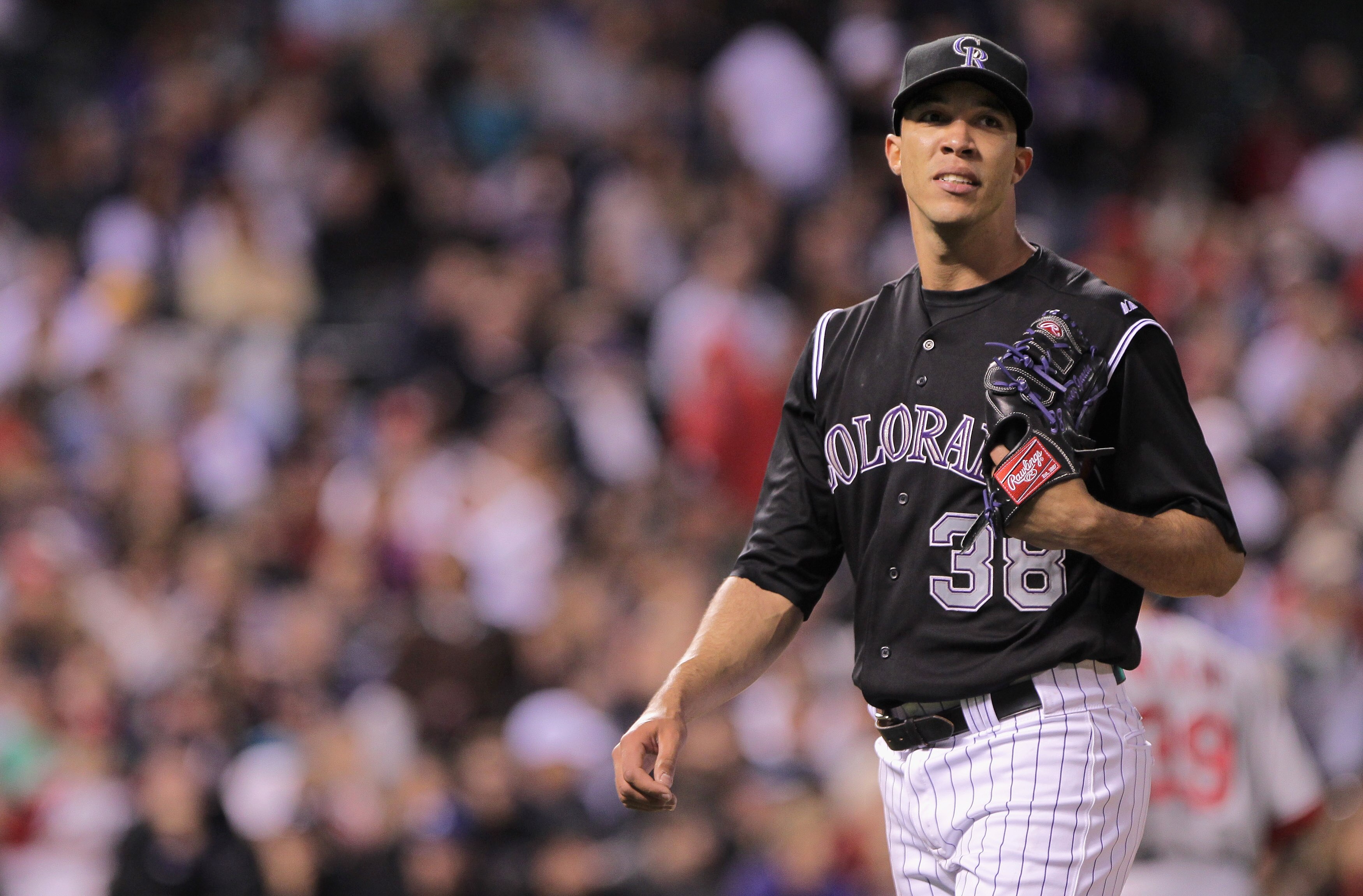 DENVER, CO - MAY 27:  Starting pitcher Ubaldo Jimenez #38 of the Colorado Rockies heads for the dugout at the end of the sixth inning against the St. Louis Cardinals at Coors Field on May 27, 2011 in Denver, Colorado.  (Photo by Doug Pensinger/Getty Image
