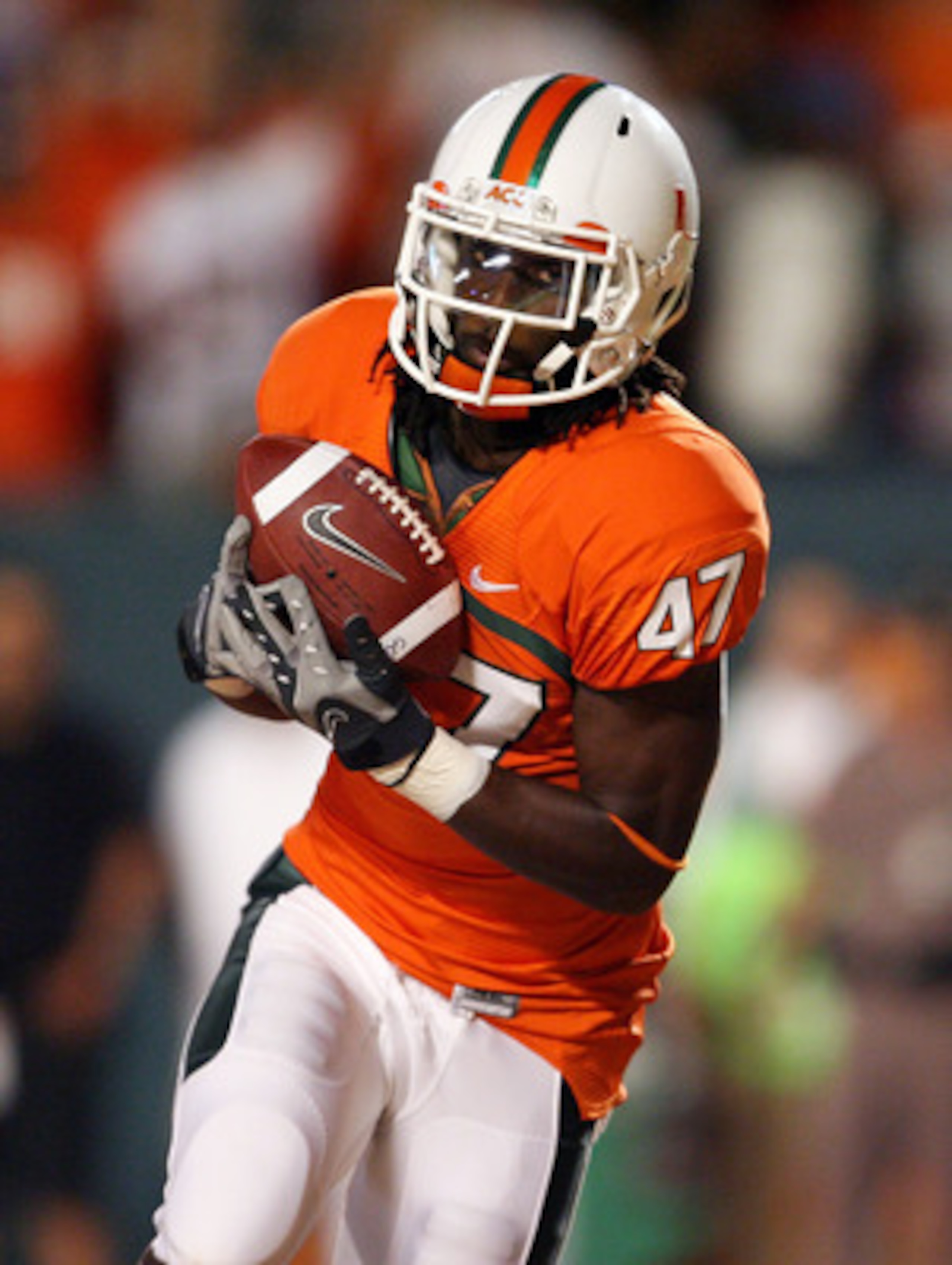 FORT LAUDERDALE, FL - SEPTEMBER 17:  Wide receiver LaRon Byrd #47 of the Miami Hurricanes catches a touchdown pass against the Georgia Tech Yellow Jackets at Land Shark Stadium on September 17, 2009 in Fort Lauderdale, Florida. Miami defeated Georgia Tech
