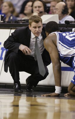WINSTON-SALEM, NC - FEBRUARY 18:  Assistant coach Steve Wojciechowski of the Duke Blue Devils bends down and talks to Shelden Williams #23 during the game against the Wake Forest Demon Deacons on February 18, 2004 at the Lawrence Joel Coliseum in Winston-