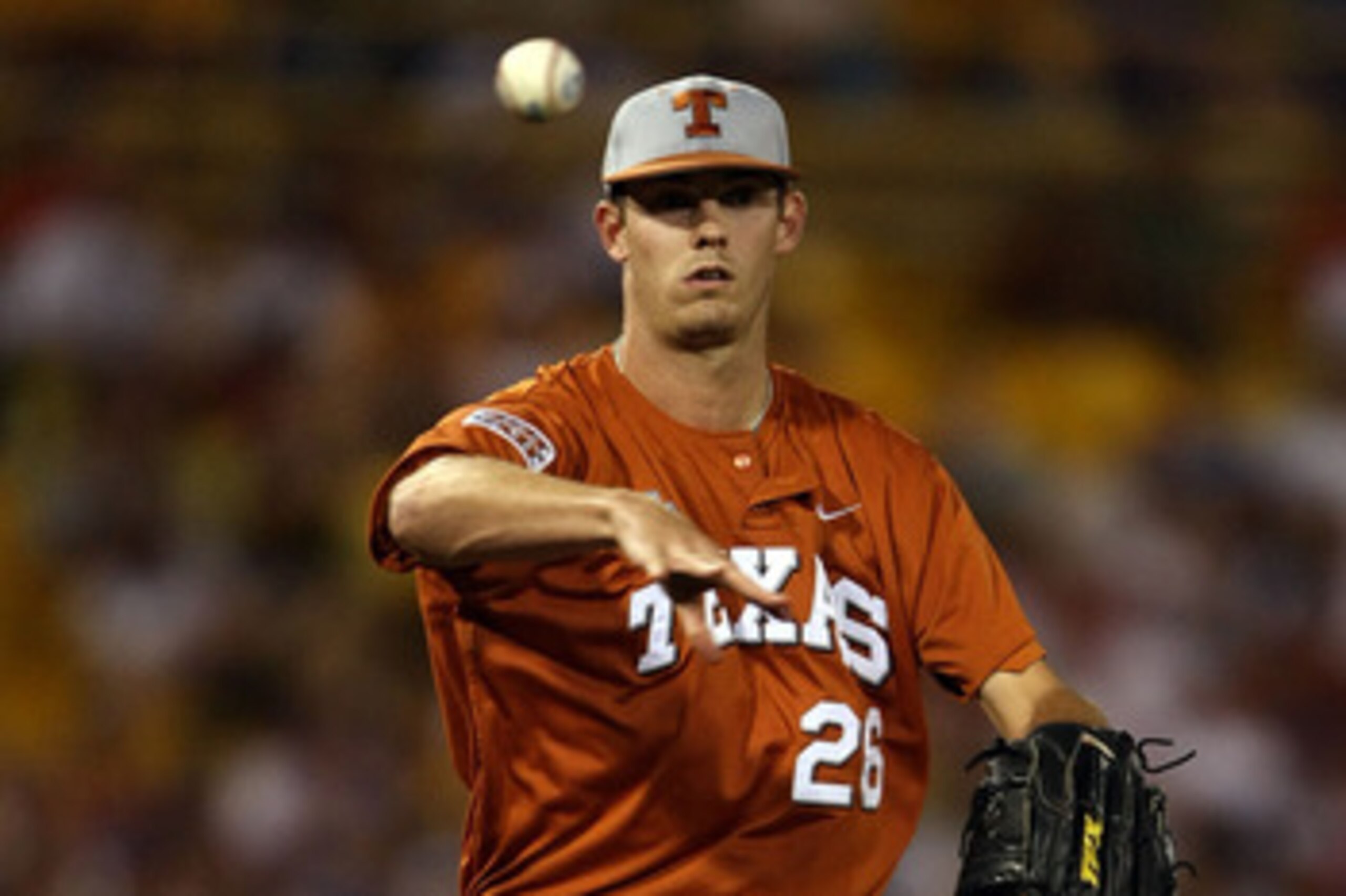 OMAHA, NE - JUNE 23:  Taylor Jungmann #26 of the Texas Longhorns sends the ball back to first against the Louisiana State University Tigers during Game 2 of the 2009 NCAA College World Series at Rosenblatt Stadium on June 23, 2009 in Omaha, Nebraska. The 