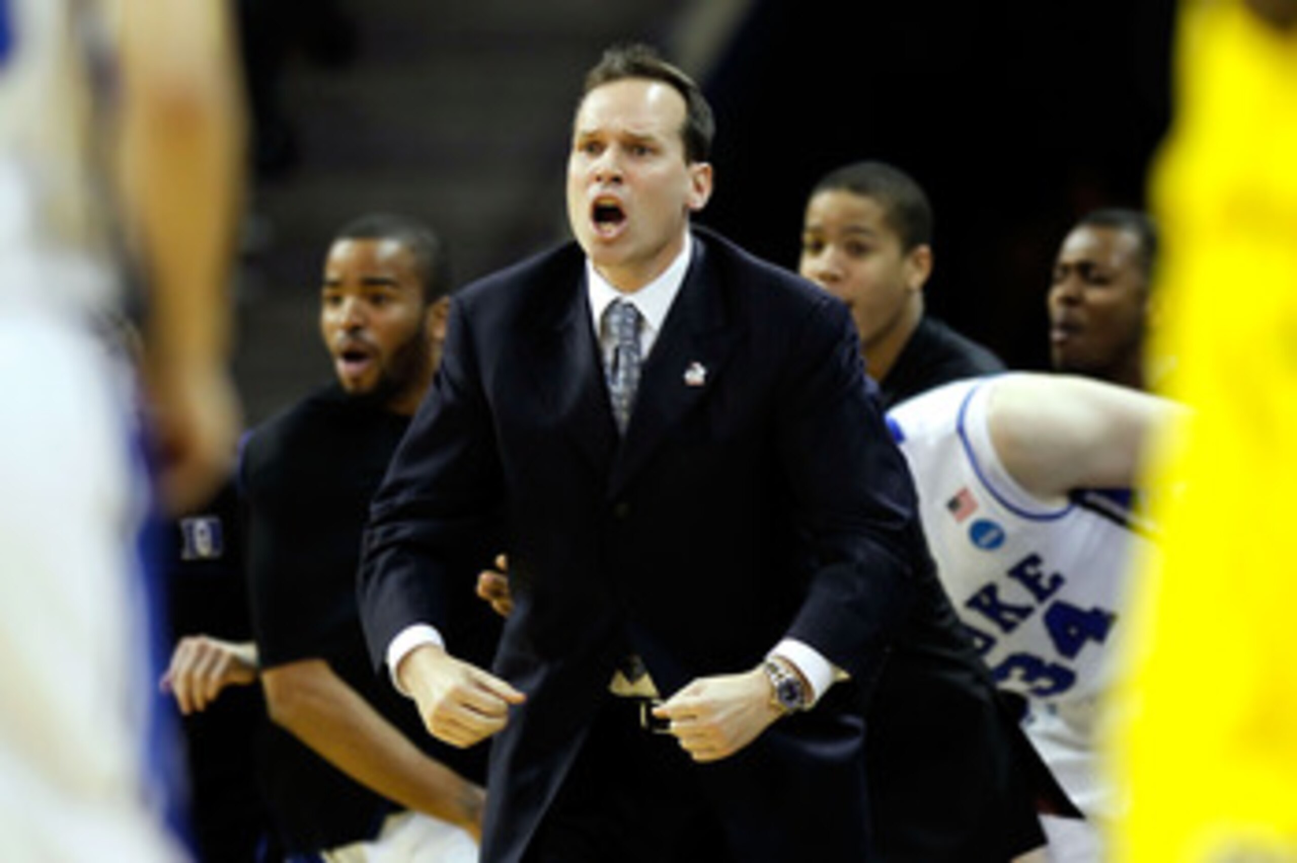 CHARLOTTE, NC - MARCH 20:  Associate head coach Chris Collins of the Duke Blue Devils reacts while taking on the Michigan Wolverines during the third round of the 2011 NCAA men's basketball tournament at Time Warner Cable Arena on March 20, 2011 in Charlo