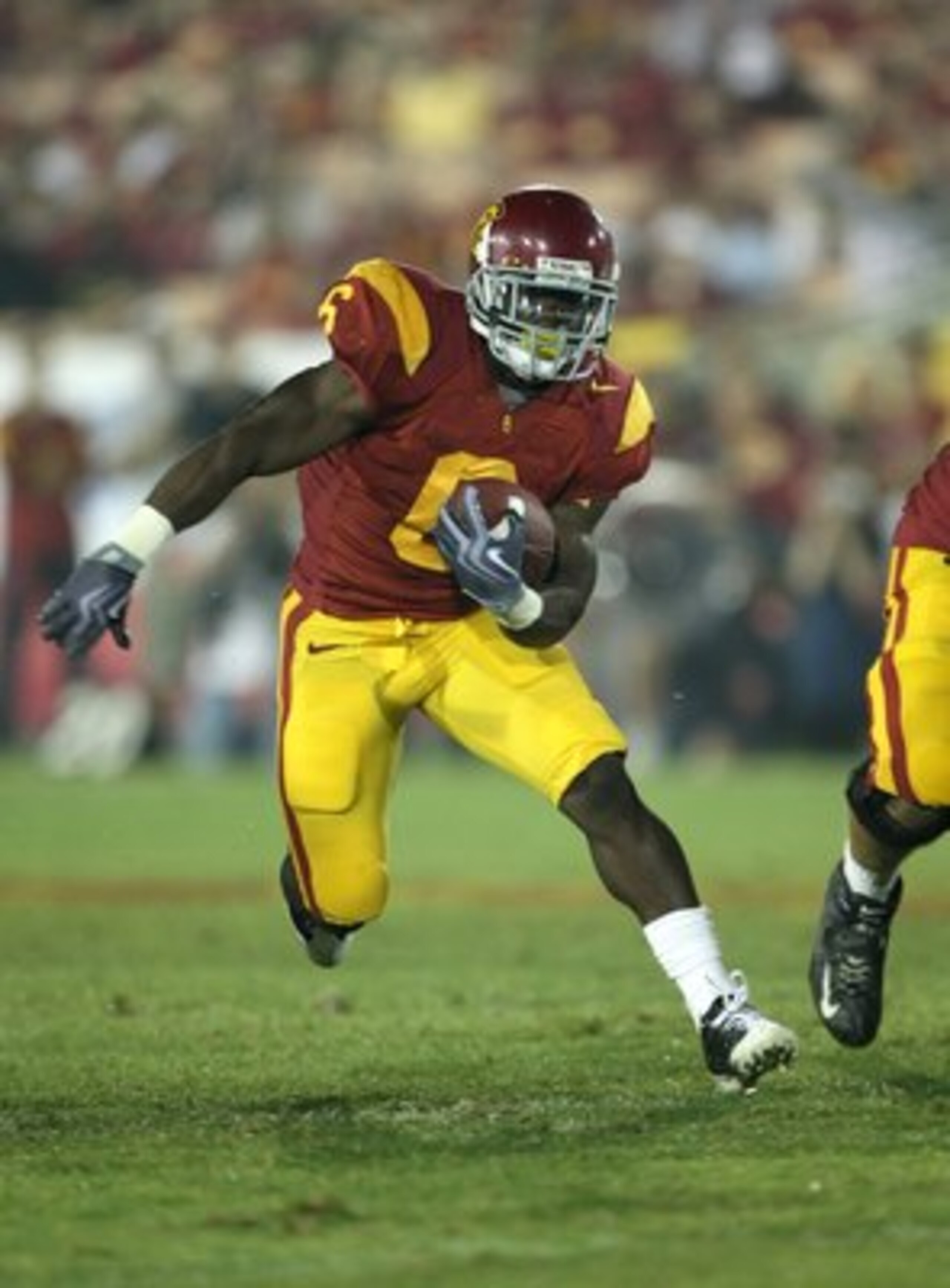 LOS ANGELES, CA - SEPTEMBER 26: Running back Curtis McNeal #6 of the USC Trojans carries the ball against the Washington State Cougars on September 23, 2009 at the Los Angeles Coliseum in Los Angeles, California. USC won 27-6. (Photo by Stephen Dunn/Ge LOS ANGELES, CA - SEPTEMBER 26: Running back Curtis McNeal #6 of the USC Trojans carries the ball against the Washington State Cougars on September 23, 2009 at the Los Angeles Coliseum in Los Angeles, California. USC won 27-6. (Photo by Stephen Dunn/Ge