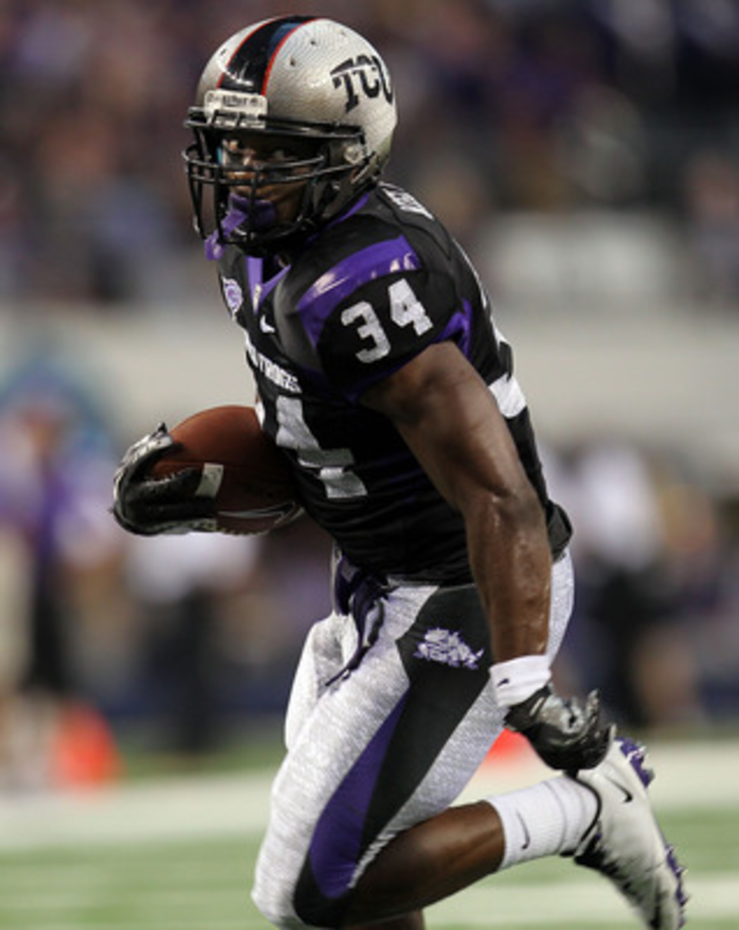 ARLINGTON, TX - SEPTEMBER 04: Tailback Ed Wesley #34 of the TCU Horned Frogs runs the ball against the Oregon State Beavers at Cowboys Stadium on September 4, 2010 in Arlington, Texas. (Photo by Ronald Martinez/Getty Images) ARLINGTON, TX - SEPTEMBER 04: Tailback Ed Wesley #34 of the TCU Horned Frogs runs the ball against the Oregon State Beavers at Cowboys Stadium on September 4, 2010 in Arlington, Texas. (Photo by Ronald Martinez/Getty Images)