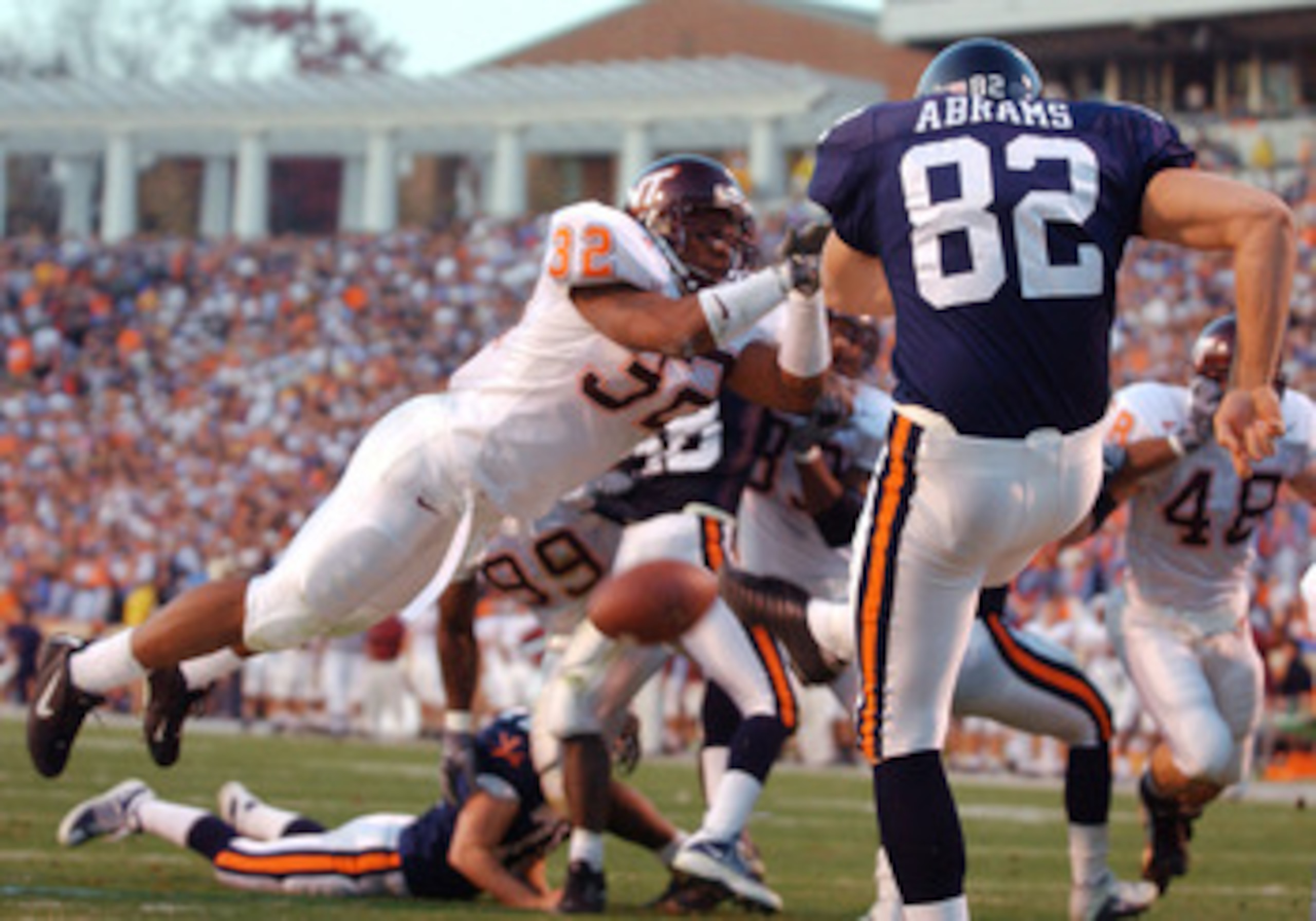 17 Nov 2001:  Wayne Ward #32 of the Virginia Tech Hokies blocks a first half punt by Mike Abrams #82 of the University of Virginia Cavaliers as the Hokies compiled a 31-0 half time lead over the Cavaliers at Scott Stadium on the campus if the University o