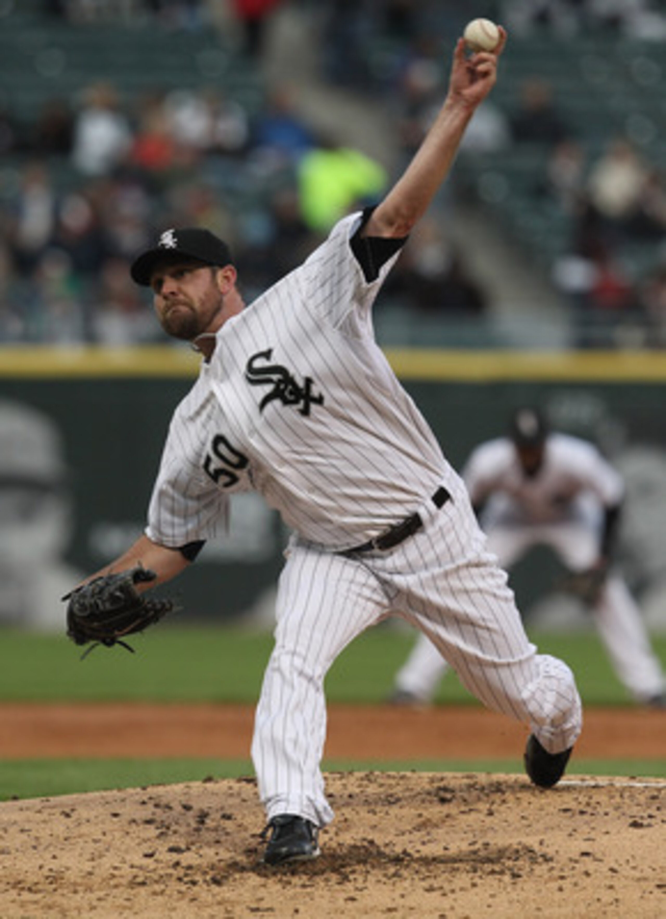 CHICAGO, IL - MAY 17: Starting pitcher John Danks #50 of the Chicago White Sox delivers the ball against the Texas Rangers at U.S. Cellular Field on May 17, 2011 in Chicago, Illinois. (Photo by Jonathan Daniel/Getty Images)
