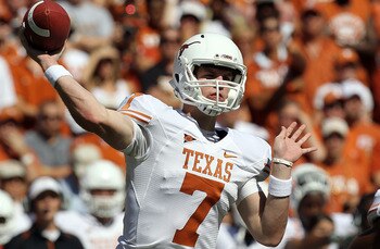 DALLAS - OCTOBER 02:  Quarterback Garrett Gilbert #7 of the Texas Longhorns drops back to pass against the Oklahoma Sooners in the second quarter at the Cotton Bowl on October 2, 2010 in Dallas, Texas.  (Photo by Ronald Martinez/Getty Images)