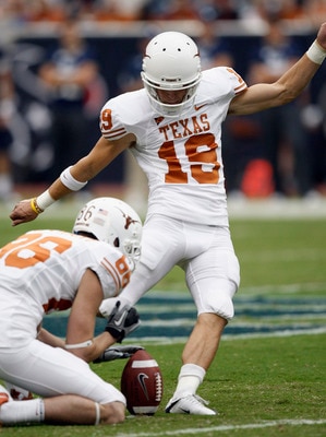 HOUSTON - SEPTEMBER 04:  Kicker Justin Tucker #19 of the Texas Longhorns kicks a field goal out of the hold of Cade McCrary #86 at Reliant Stadium on September 4, 2010 in Houston, Texas.  (Photo by Bob Levey/Getty Images)