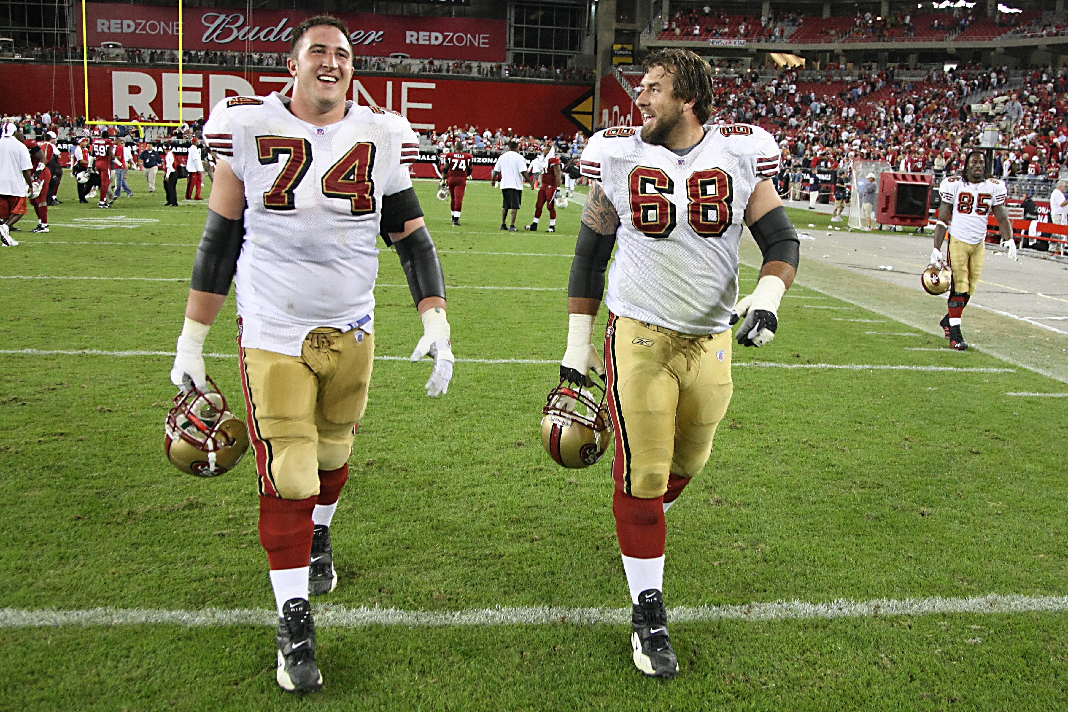 GLENDALE - NOVEMBER 25:  Joe Staley #74 and Adam Snyder #68 of the San Francisco 49ers walk on the field during the NFL game against the Arizona Cardinals at University of Phoenix Stadium on November 25, 2007 in Glendale, Arizona. (Photo by Stephen Dunn/G