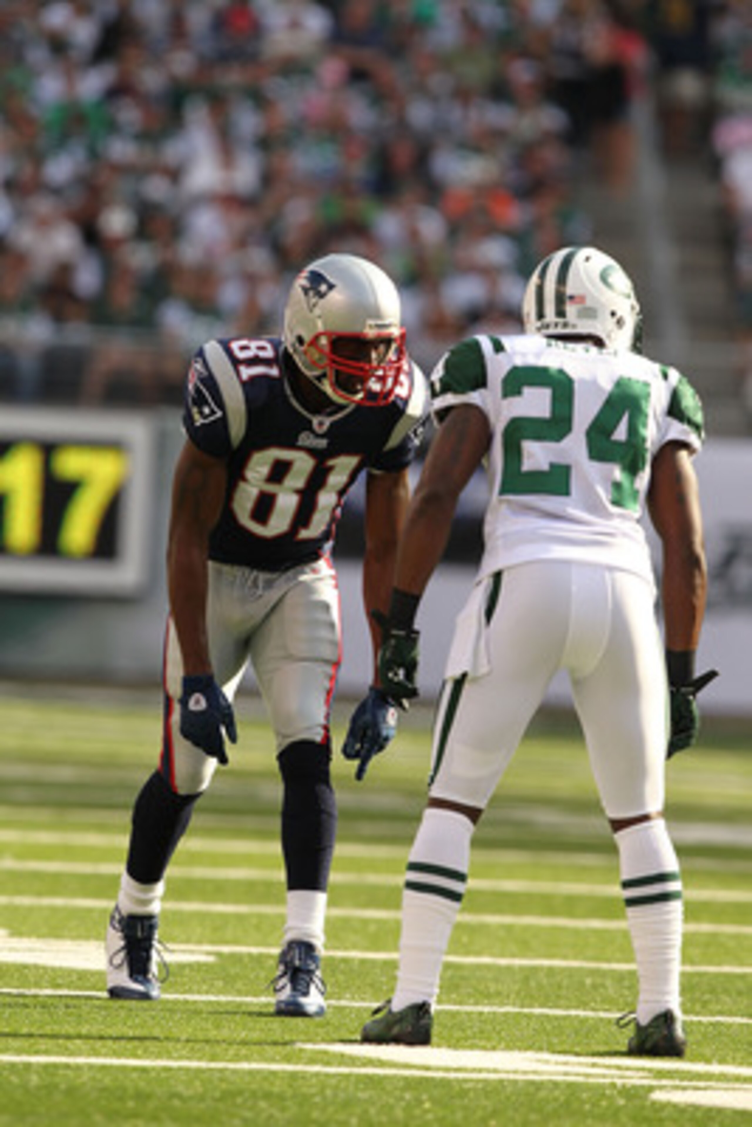 EAST RUTHERFORD, NJ - SEPTEMBER 19:  Darrelle Revis #24 of the New York Jets defends against Randy Moss #81 of the New England Patriots during their  game on September 19, 2010 at the New Meadowlands Stadium  in East Rutherford, New Jersey.  (Photo by Al 