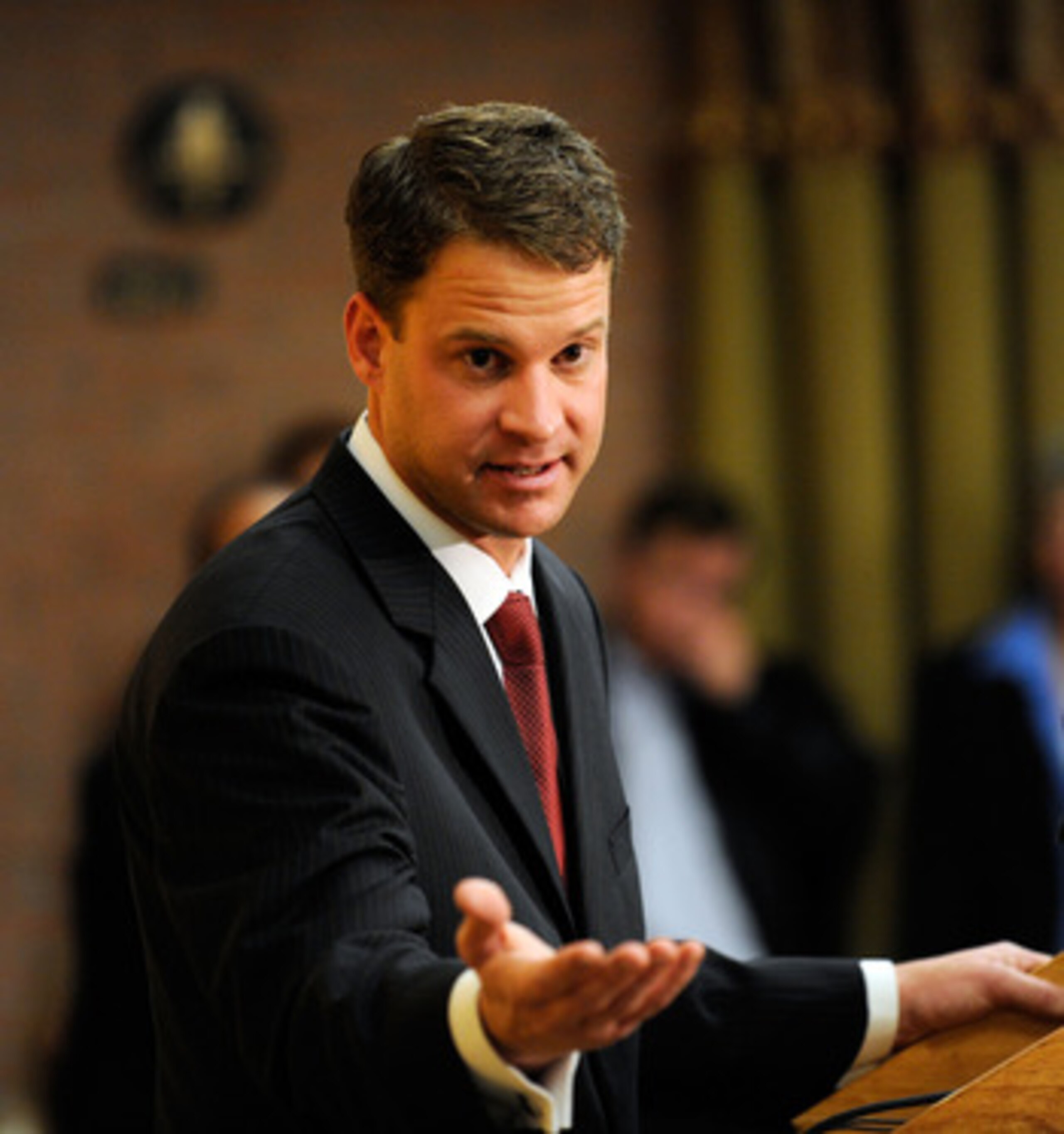 LOS ANGELES, CA - JANUARY 13:  Lane Kiffin (L)  the new college football coach of University of Southern California speaks during a news conference at Heritage Hall on the campus of USC on January 13, 2010 in Los Angeles, California.  (Photo by Kevork Dja