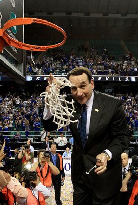 GREENSBORO, NC - MARCH 13:  Head coach Mike Krzyzewski of the Duke Blue Devils cuts down the net after defeating the North Carolina Tar Heels 75-58 in the championship game of the 2011 ACC men's basketball tournament at the Greensboro Coliseum on March 13