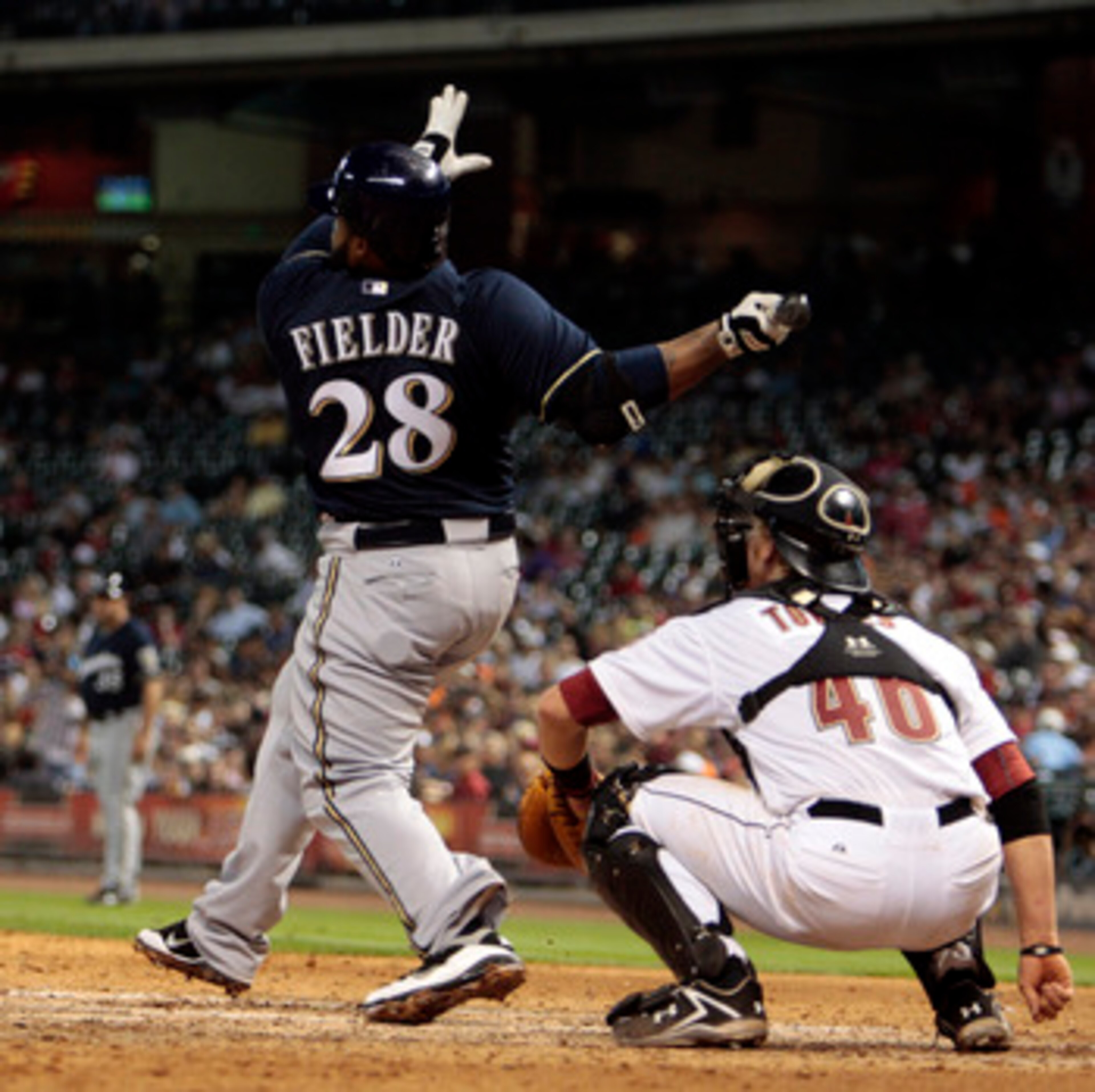 HOUSTON - APRIL 30:  Prince Fielder #28 of the Milwaukee Brewers and catcher J.R. Towels #46 of the Houston Astros watch the ball leave the park in the ninth inning as he hits a home run to right field to tie the game against the Houston Astros at Minute