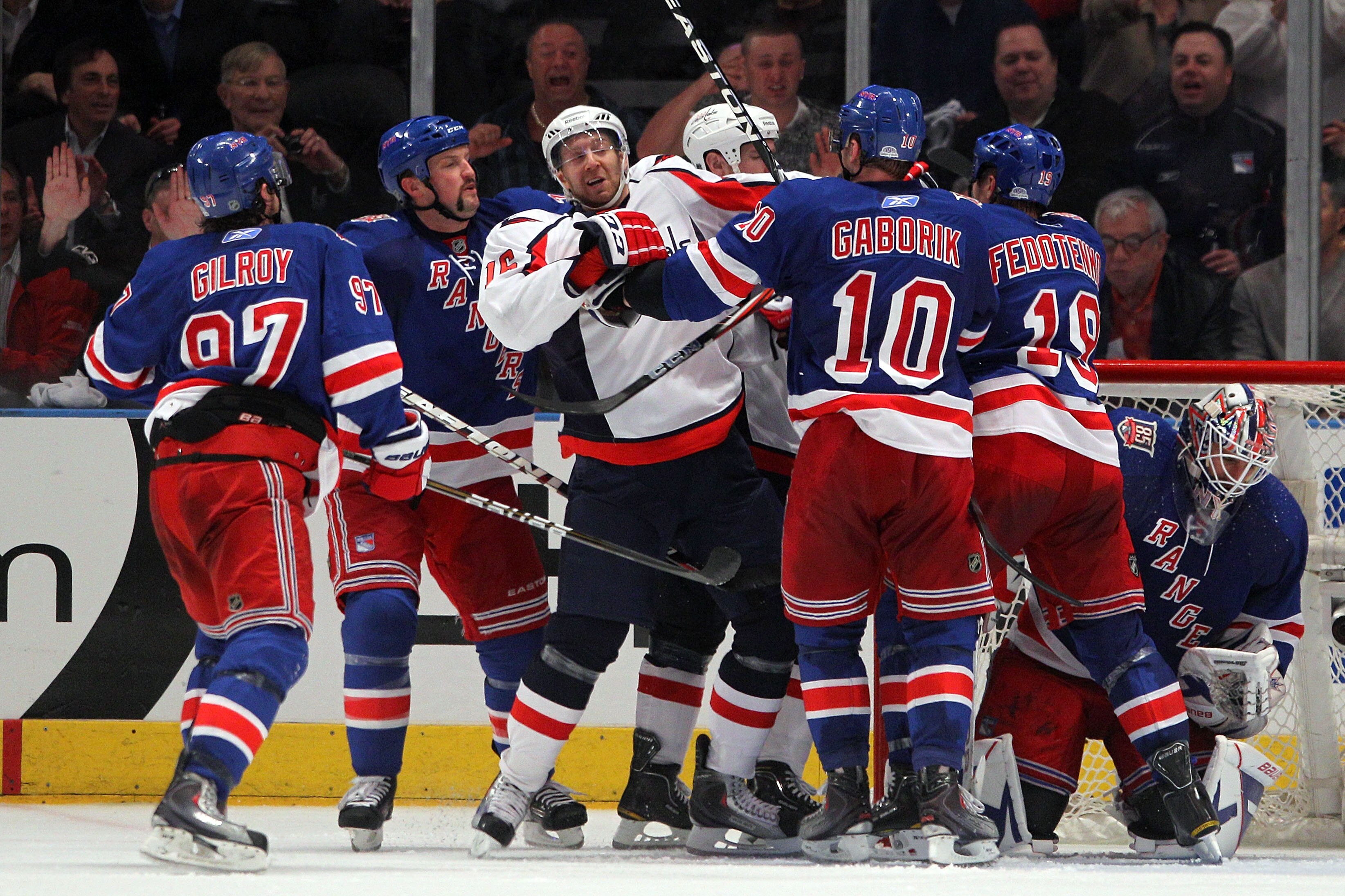 NEW YORK, NY - APRIL 20:  Eric Fehr (C) #16 of the Washington Capitals and the Marian Gaborik #10 of the New York Rangers push and shove each other in front of the net along with their teammates in Game Four of the Eastern Conference Quarterfinals during