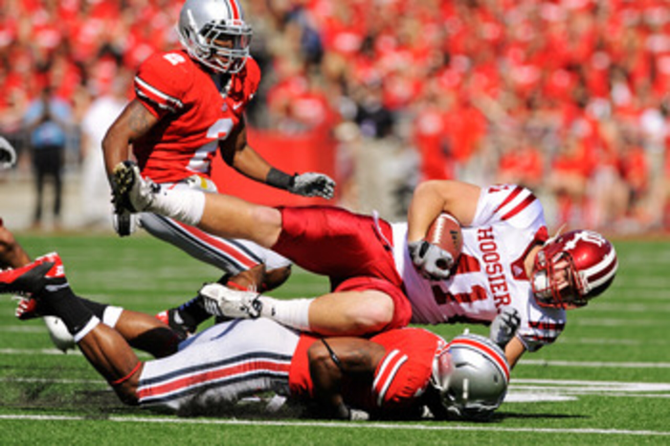 COLUMBUS, OH - OCTOBER 9:  Max Dedmond #41 of the Indiana Hoosiers is brought down by Jermale Hines #7 of the Ohio State Buckeyes after a pass reception at Ohio Stadium on October 9, 2010 in Columbus, Ohio.  (Photo by Jamie Sabau/Getty Images)