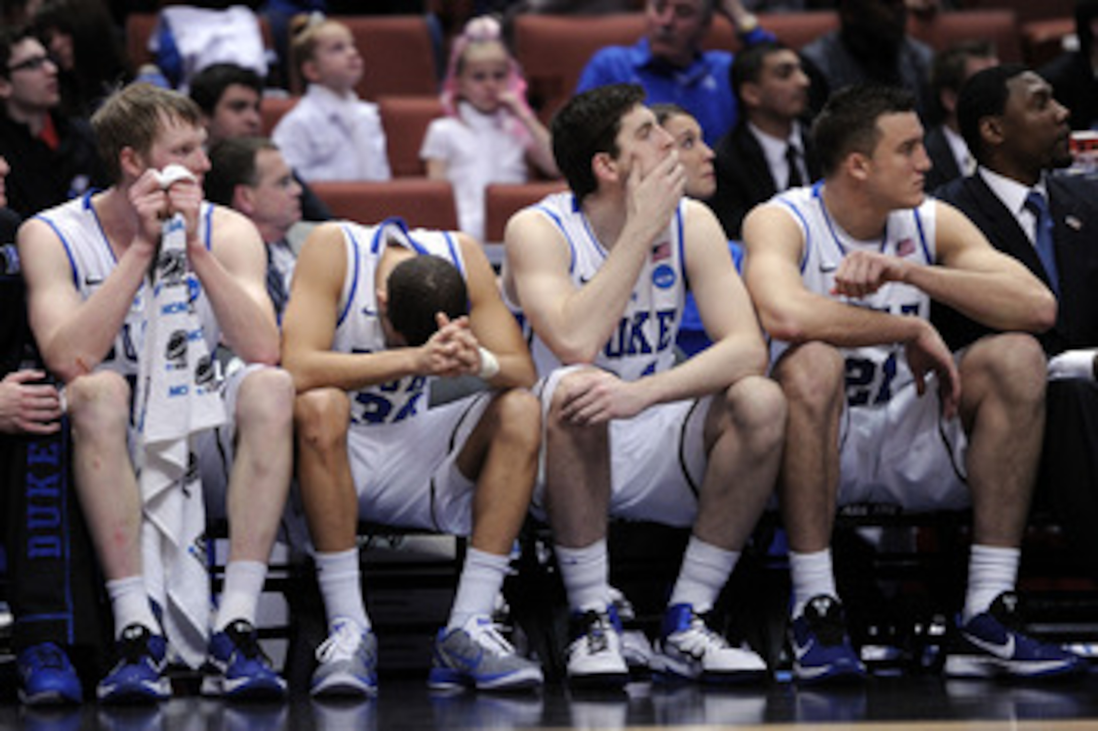 ANAHEIM, CA - MARCH 24: Kyle Singler #12, Seth Curry #30, Ryan Kelly #34 and Miles Plumlee #21 of the Duke Blue Devils look on from the bench against the Arizona Wildcats during the west regional semifinal of the 2011 NCAA men's basketball tournament at ANAHEIM, CA - MARCH 24: Kyle Singler #12, Seth Curry #30, Ryan Kelly #34 and Miles Plumlee #21 of the Duke Blue Devils look on from the bench against the Arizona Wildcats during the west regional semifinal of the 2011 NCAA men's basketball tournament at