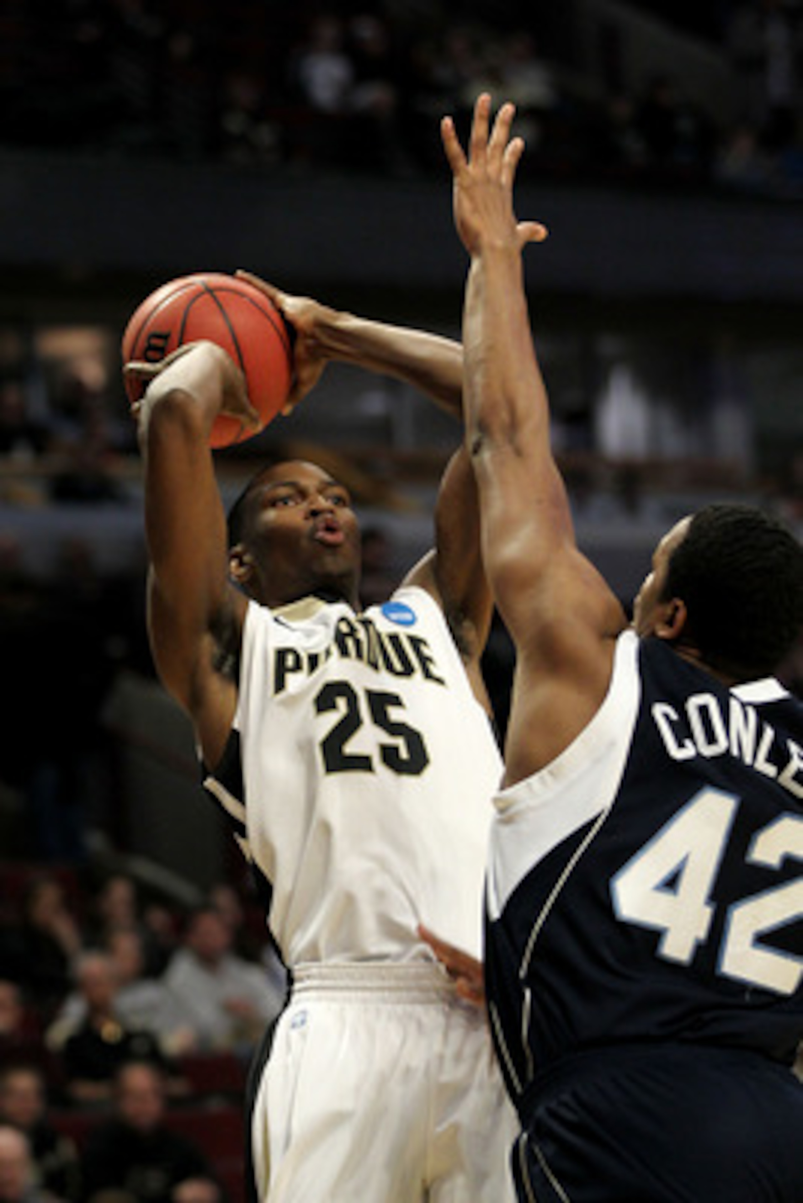CHICAGO, IL - MARCH 18:  JaJuan Johnson #25 of the Purdue Boilermakers shoots against Darius Conley #42 of the St. Peter's Peacocks in the first half during the second round of the 2011 NCAA men's basketball tournament at the United Center on March 18, 20