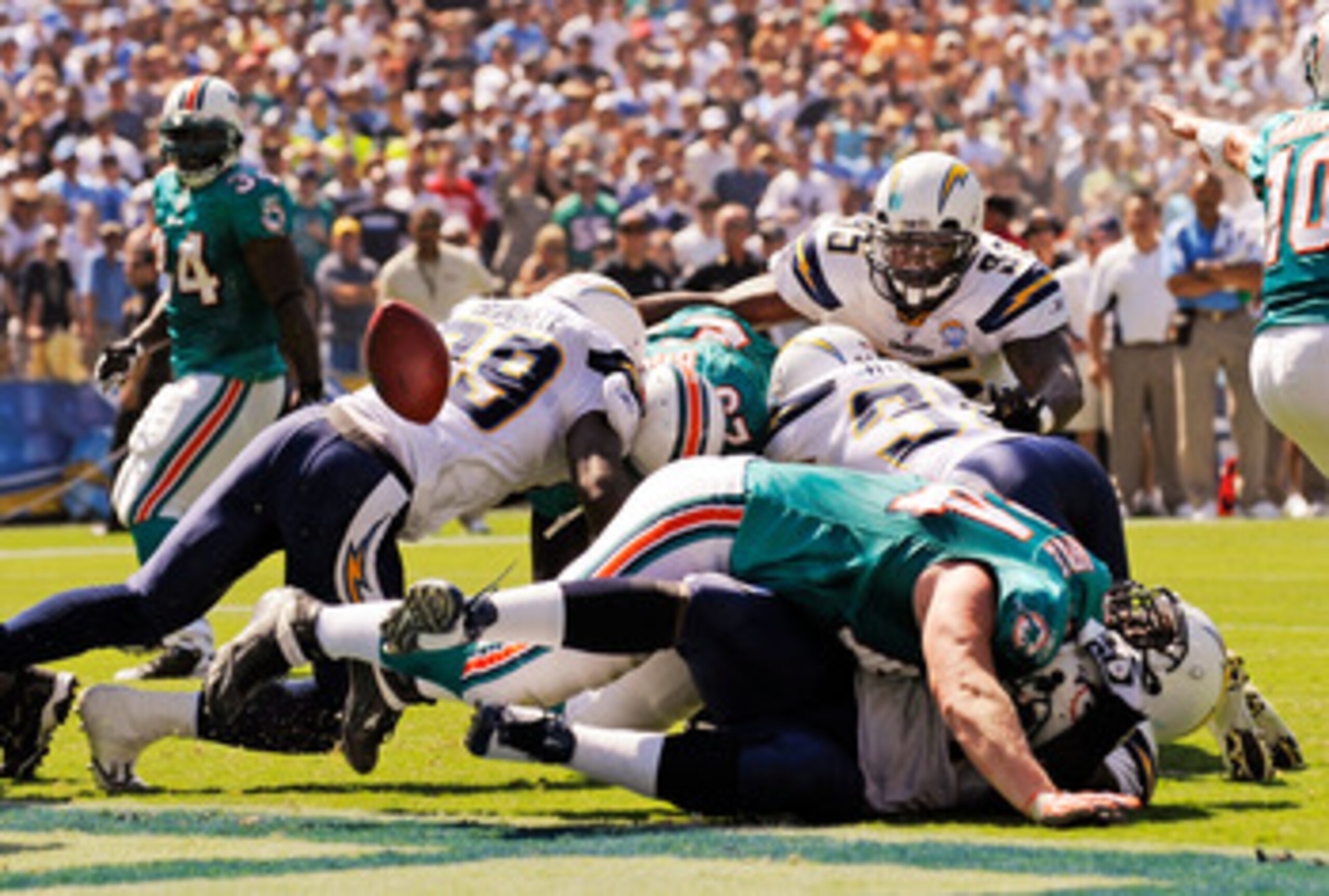 SAN DIEGO - SEPTEMBER 27: Ronnie Brown #23 of the Miami Dolphins fumbles the ball on the one yard line against San Diego Chargers during first quarter of the NFL football game as at Qualcomm Stadium on September 27, 2009 in San Diego, California.  (Photo