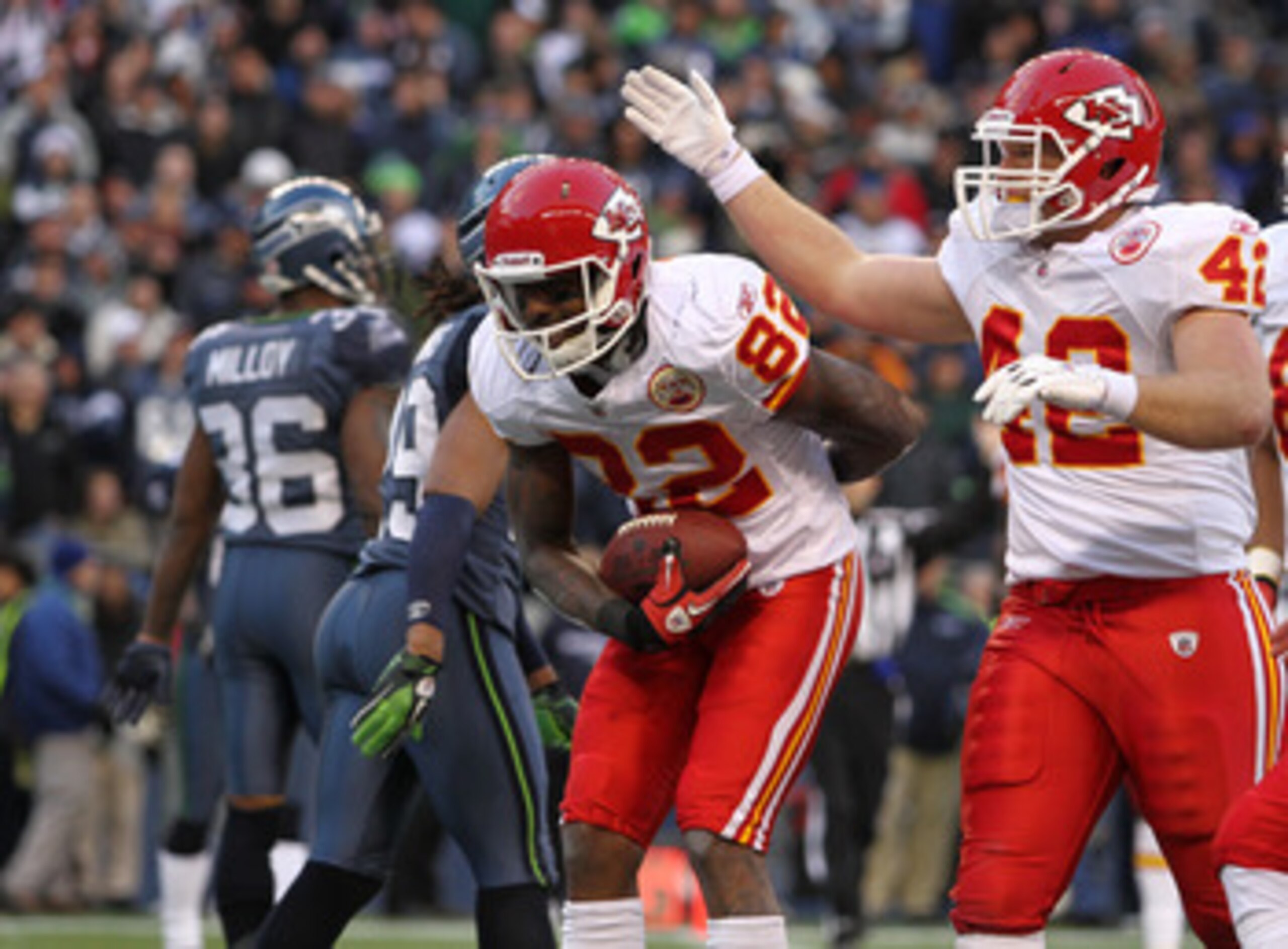 SEATTLE, WA - NOVEMBER 28:  Wide receiver Dwayne Bowe #82 of the Kansas City Chiefs takes a bow after scoring his third touchdown against the Seattle Seahawks at Qwest Field on November 28, 2010 in Seattle, Washington. Mike Cox #42 offers congratulations.