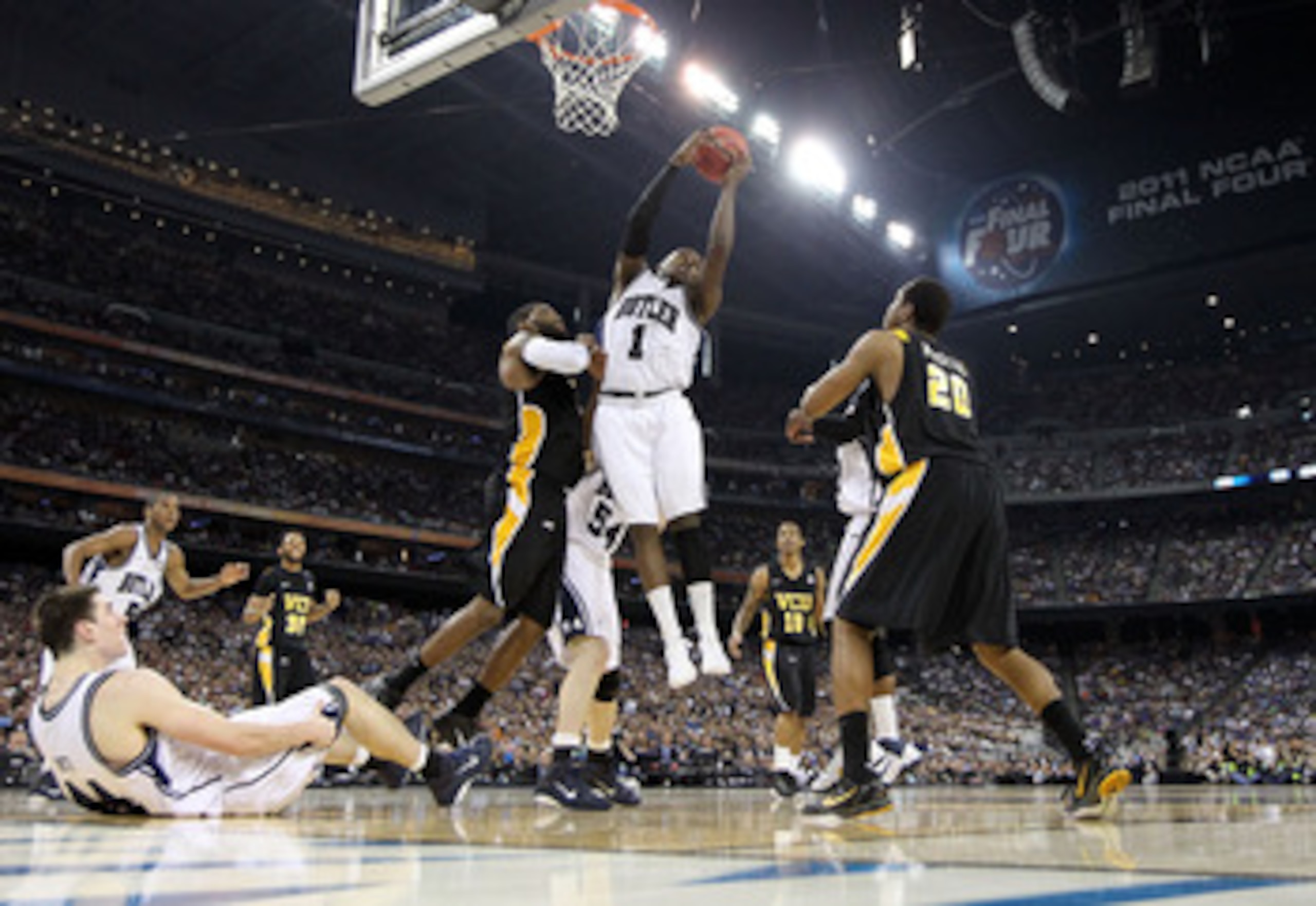 HOUSTON, TX - APRIL 02:  Shelvin Mack #1 of the Butler Bulldogs goes up for the ball against Jamie Skeen #21 and Bradford Burgess #20 of the Virginia Commonwealth Rams during the National Semifinal game of the 2011 NCAA Division I Men's Basketball Champio