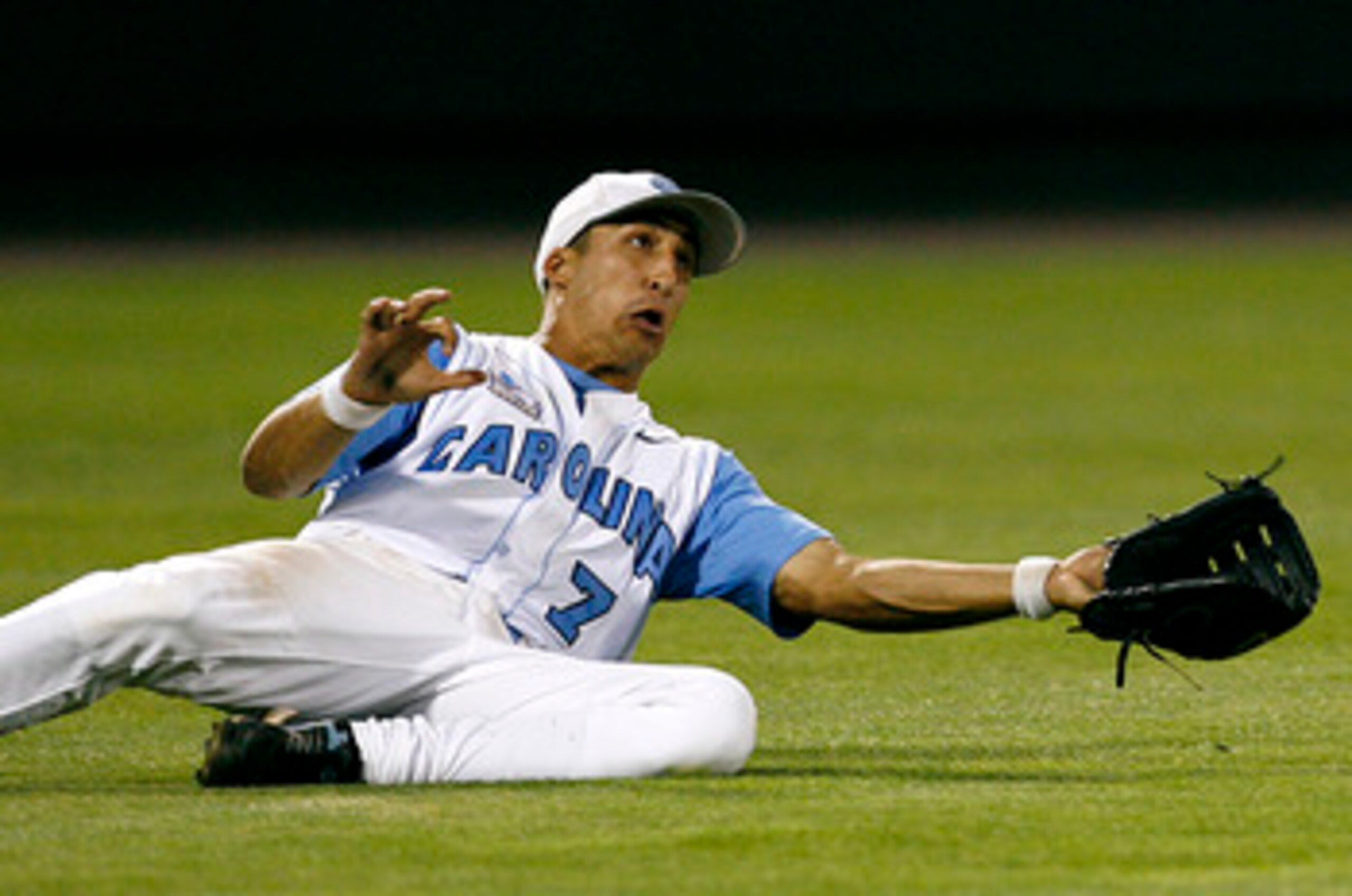 OMAHA, NE - JUNE 24:  Leftfielder Reid Fronk #7 of the North Carolina Tar Heels attempts to make a sliding catch in the outfield during their 9-3 loss to the Oregon State Beavers in Game 2 of the NCAA College World Series Championship at Rosenblatt Stadiu
