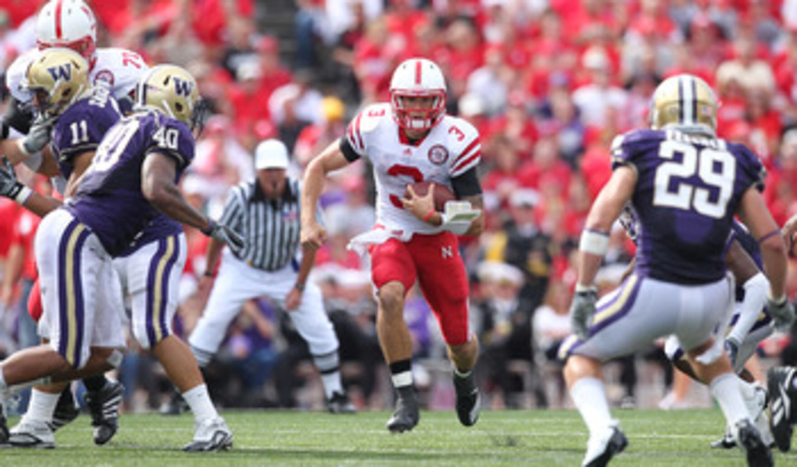 SEATTLE - SEPTEMBER 18: Quarterback Taylor Martinez #3 of the Nebraska Cornhuskers rushes against the Washington Huskies on September 18, 2010 at Husky Stadium in Seattle, Washington. (Photo by Otto Greule Jr/Getty Images) SEATTLE - SEPTEMBER 18: Quarterback Taylor Martinez #3 of the Nebraska Cornhuskers rushes against the Washington Huskies on September 18, 2010 at Husky Stadium in Seattle, Washington. (Photo by Otto Greule Jr/Getty Images)
