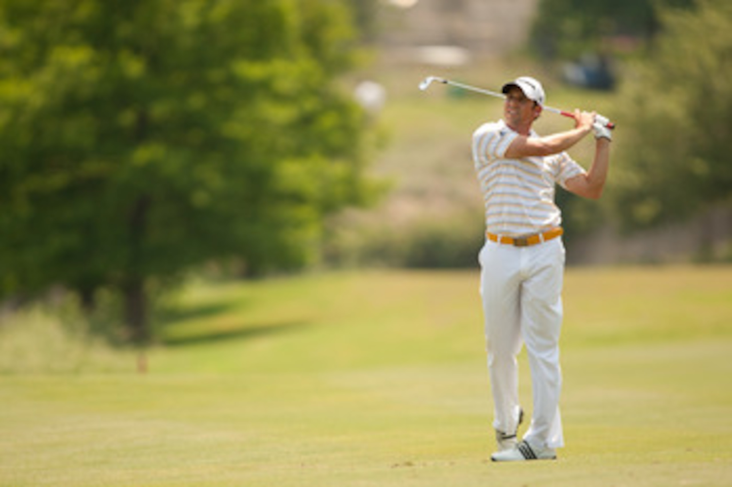 IRVING, TX - MAY 28: Sergio Garcia of Spain follows through on an approach shot during the third round of the HP Byron Nelson Championship at TPC Four Seasons at Las Colinas on May 28, 2011 in Irving, Texas. (Photo by Darren Carroll/Getty Images)